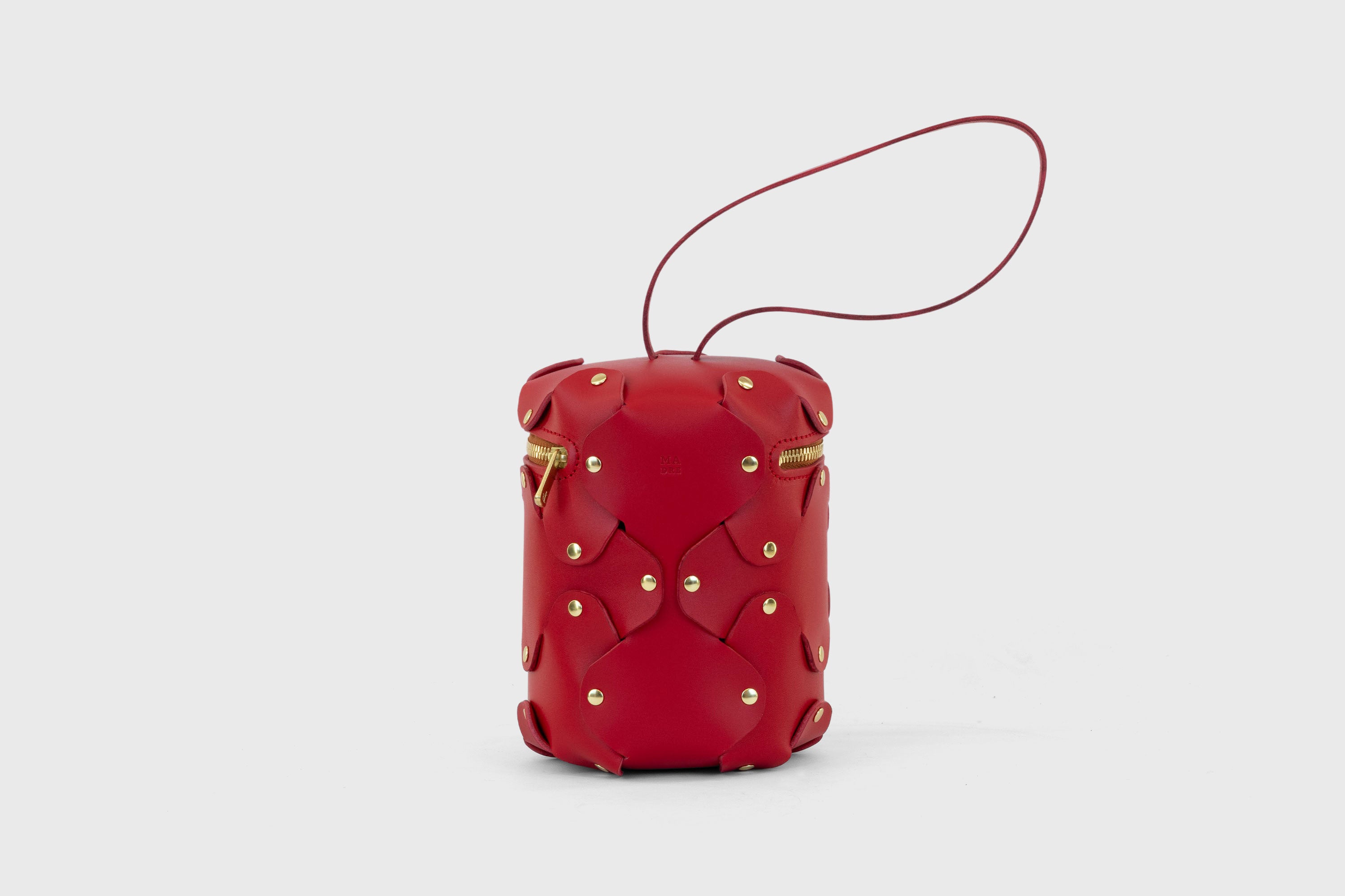 Nema Leather Bag Red Color Vegetable Tanned Full Grain Spain Brass Rivets Premium Design Minimalist Modern Cylinder Circle Round Zipper Pouch Handbag Clutch Bag Atelier Madre Manuel Dreesmann Barcelona
