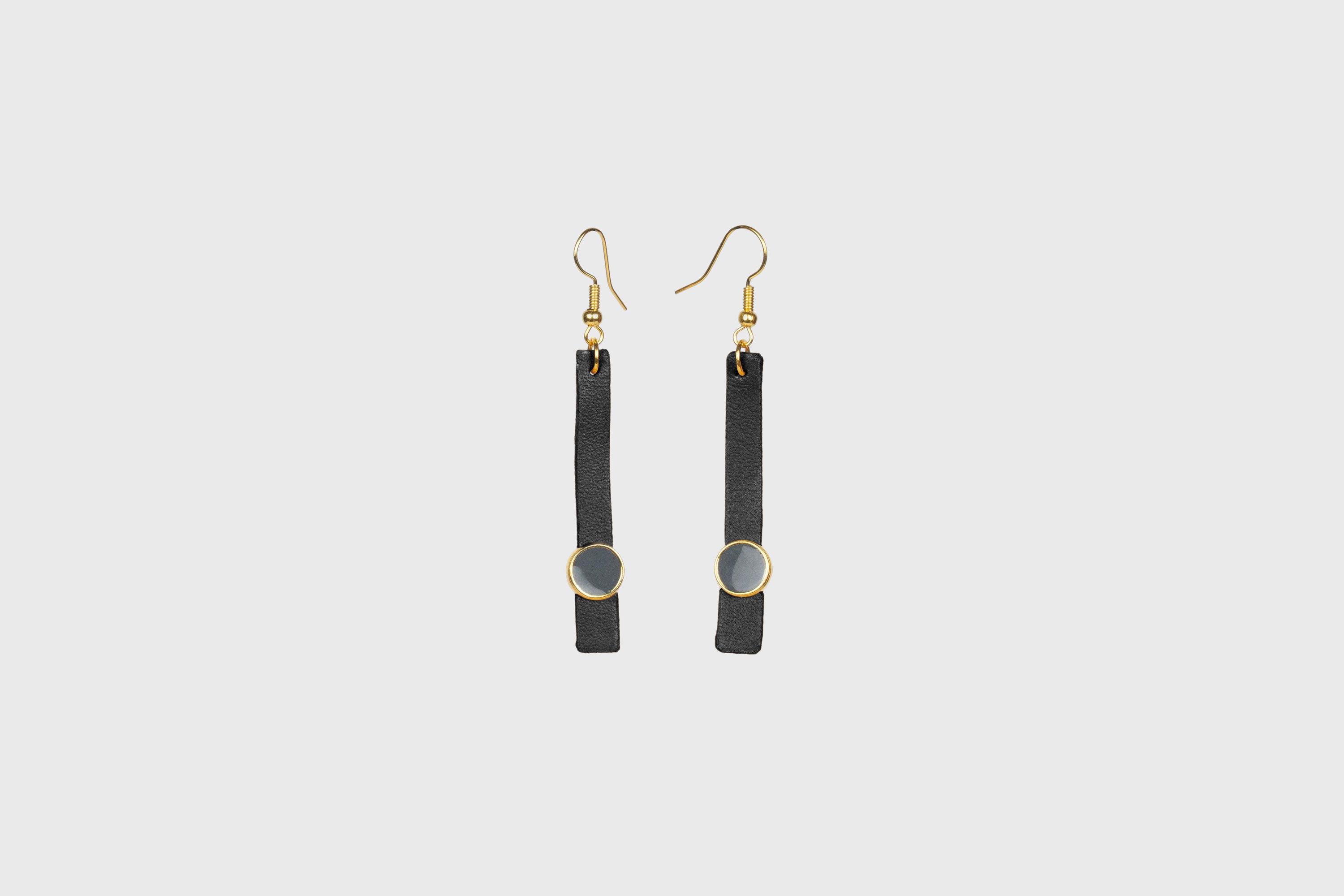 Nuria Earrings In Black Color Vegetable Tanned Leather Gold Brass Hook Minimalistic Design Atelier Madre Manuel Dreesmann Barcelona Spain