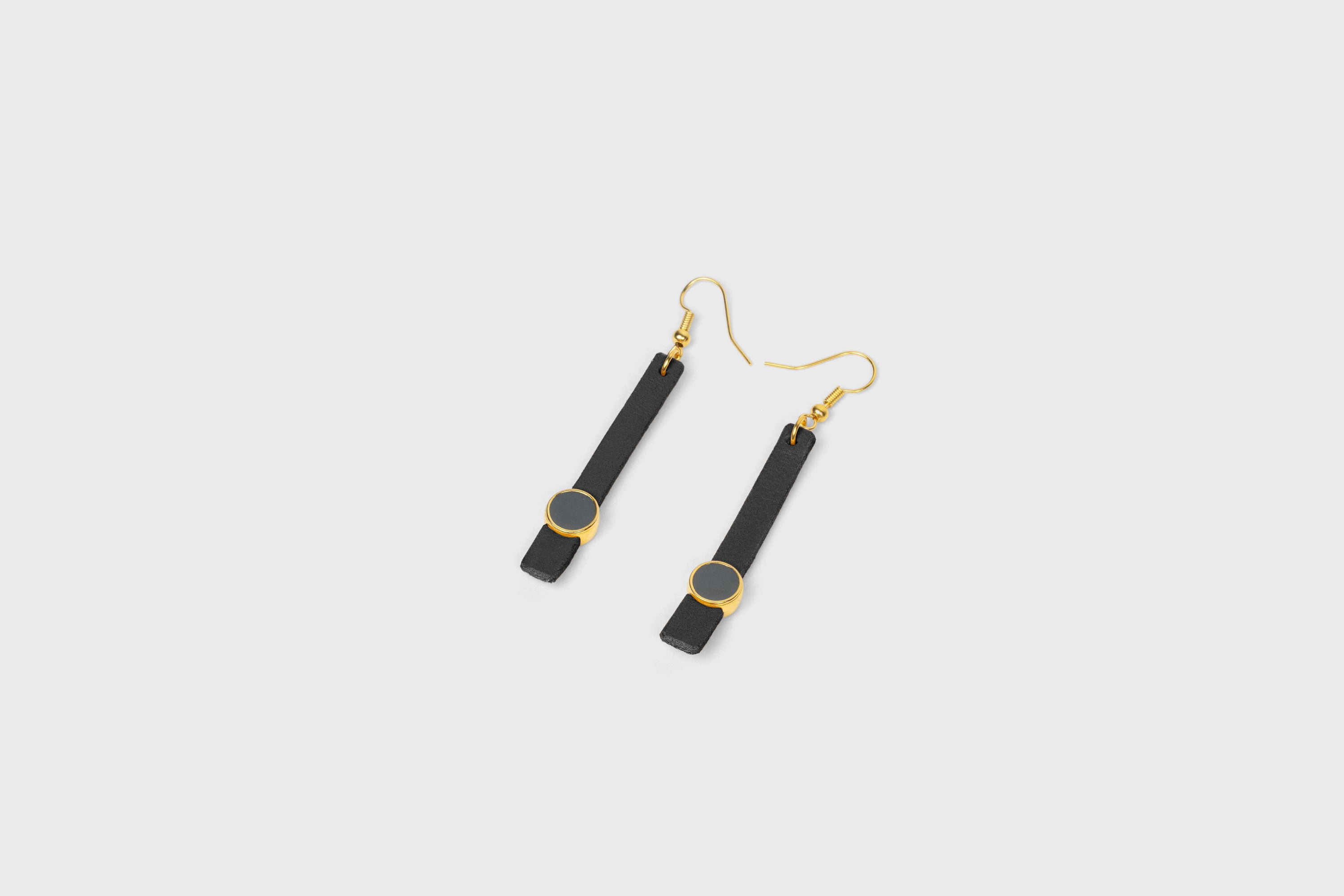 Nuria Earrings In Black Color Vegetable Tanned Leather Gold Brass Hook Minimalistic Design Atelier Madre Manuel Dreesmann Barcelona Spain