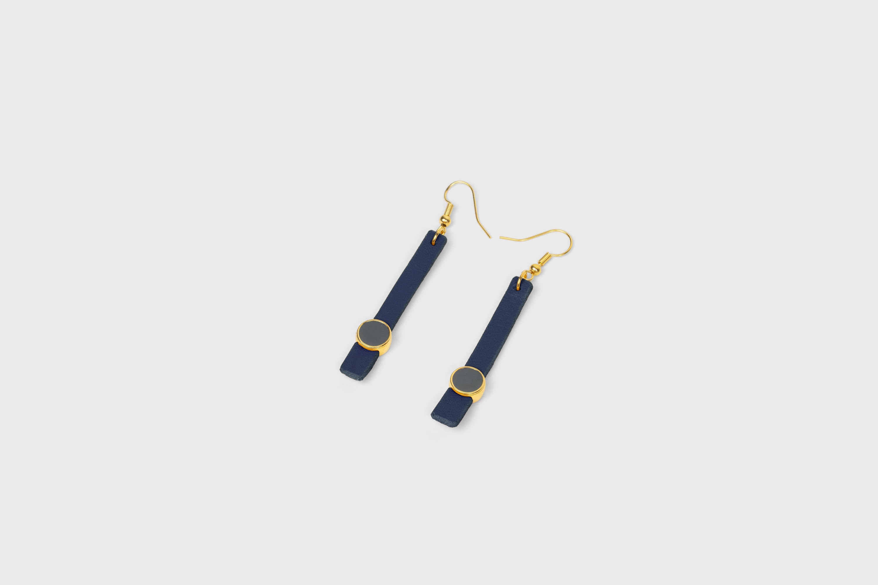 Nuria Earrings In Marine Blue Color Vegetable Tanned Leather Gold Brass Hook Minimalistic Design Atelier Madre Manuel Dreesmann Barcelona Spain