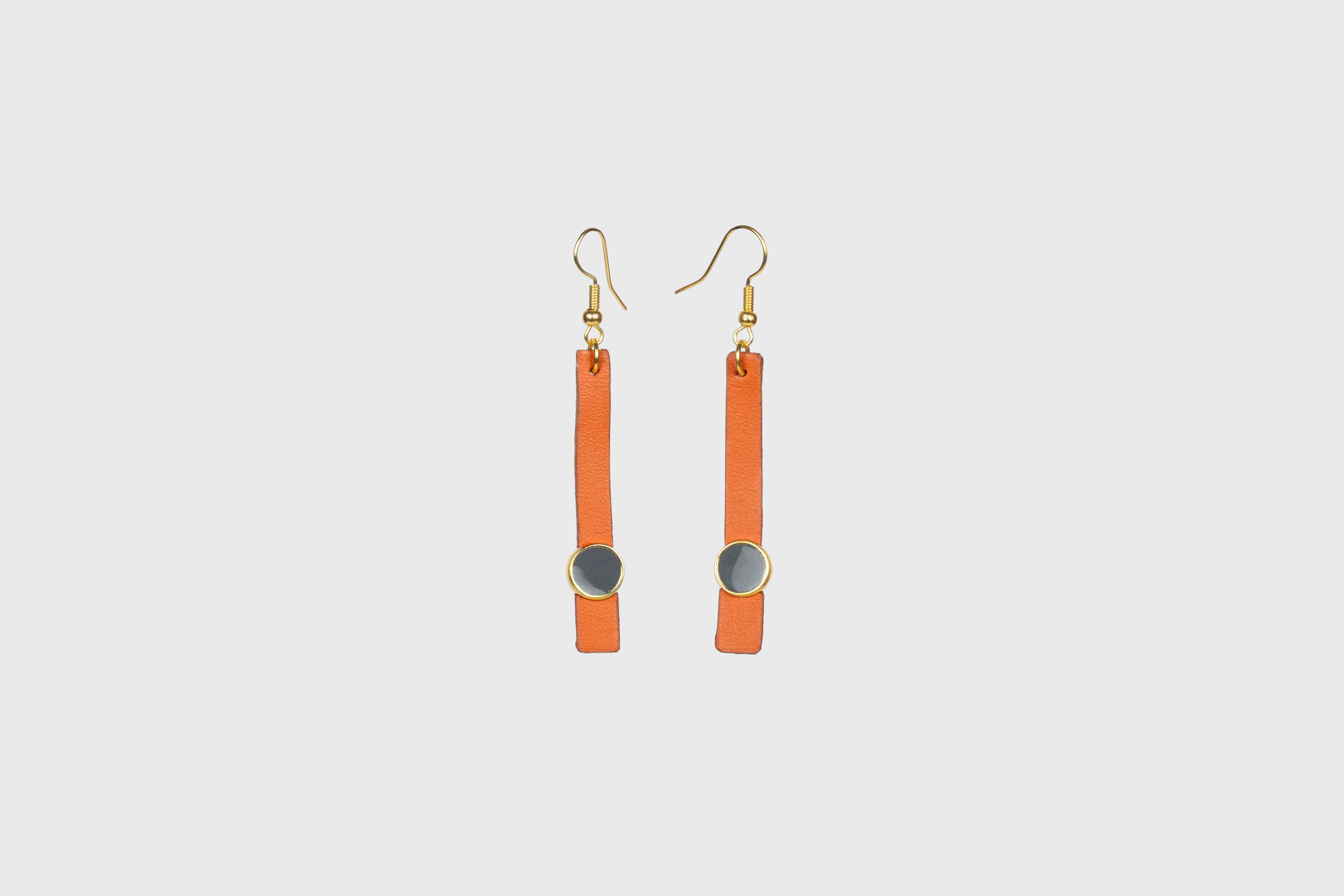 Nuria Earrings In Orange Color Vegetable Tanned Leather Gold Brass Hook Minimalistic Design Atelier Madre Manuel Dreesmann Barcelona Spain