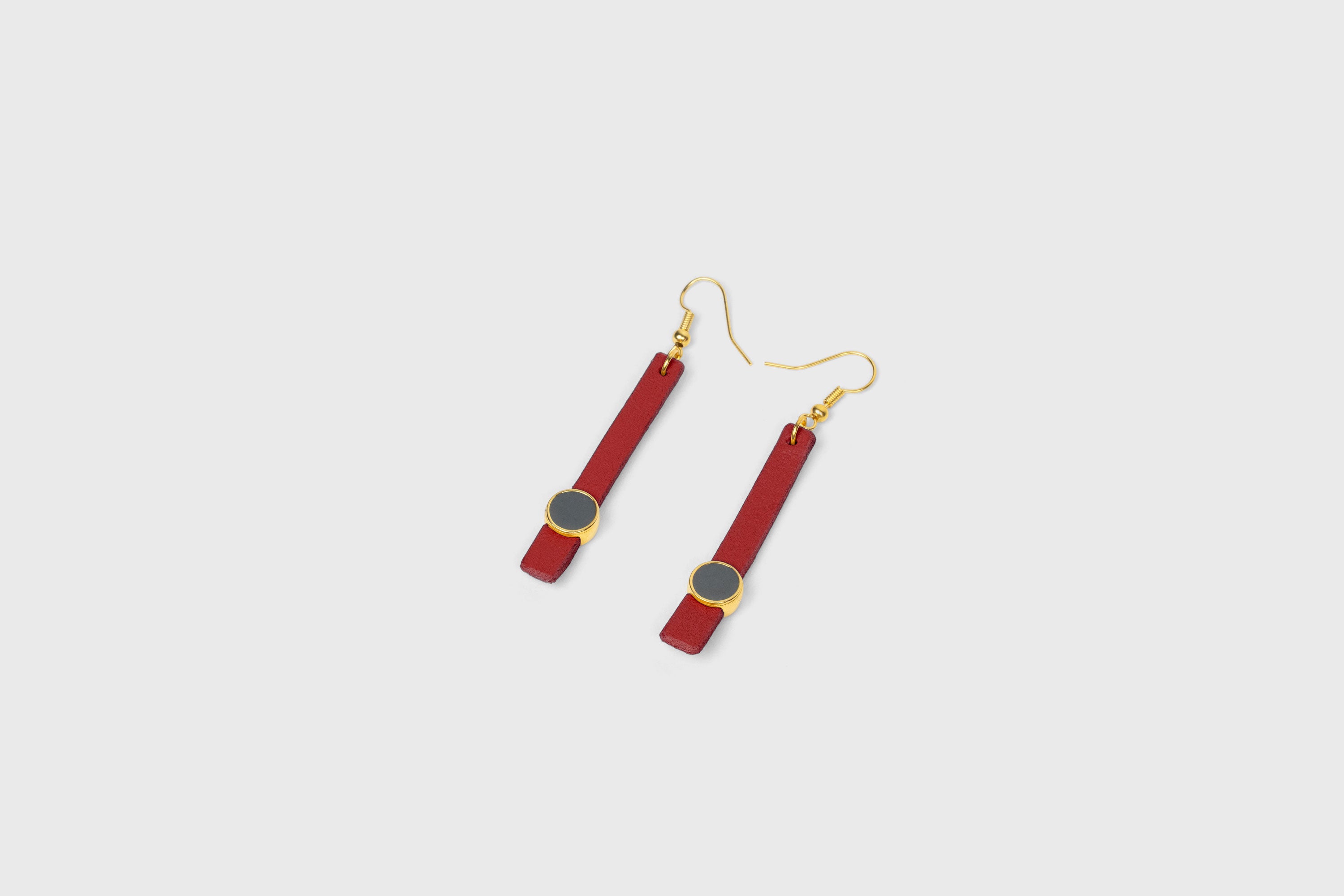 Nuria Earrings In Red Color Vegetable Tanned Leather Gold Brass Hook Minimalistic Design Atelier Madre Manuel Dreesmann Barcelona Spain