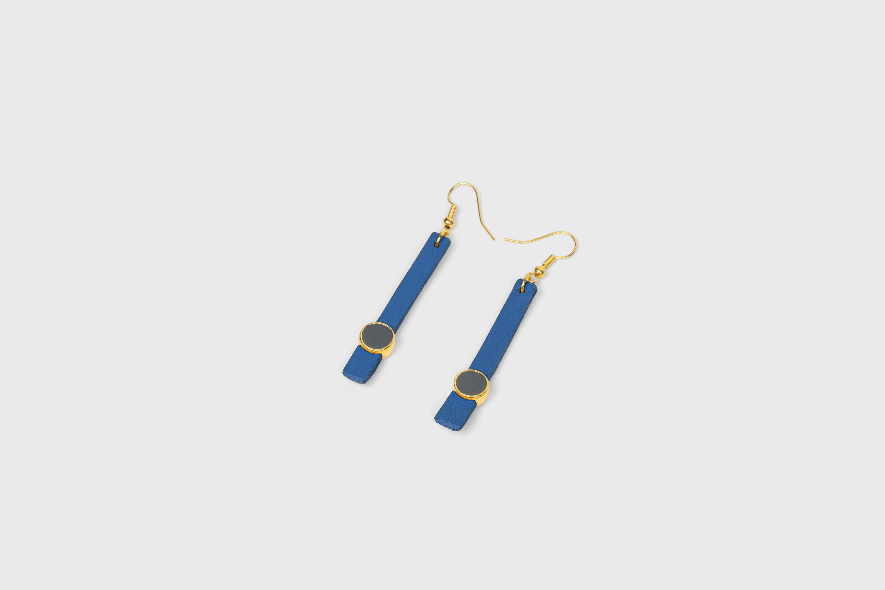 Nuria Earrings In Royal Blue Color Vegetable Tanned Leather Gold Brass Hook Minimalistic Design Atelier Madre Manuel Dreesmann Barcelona Spain