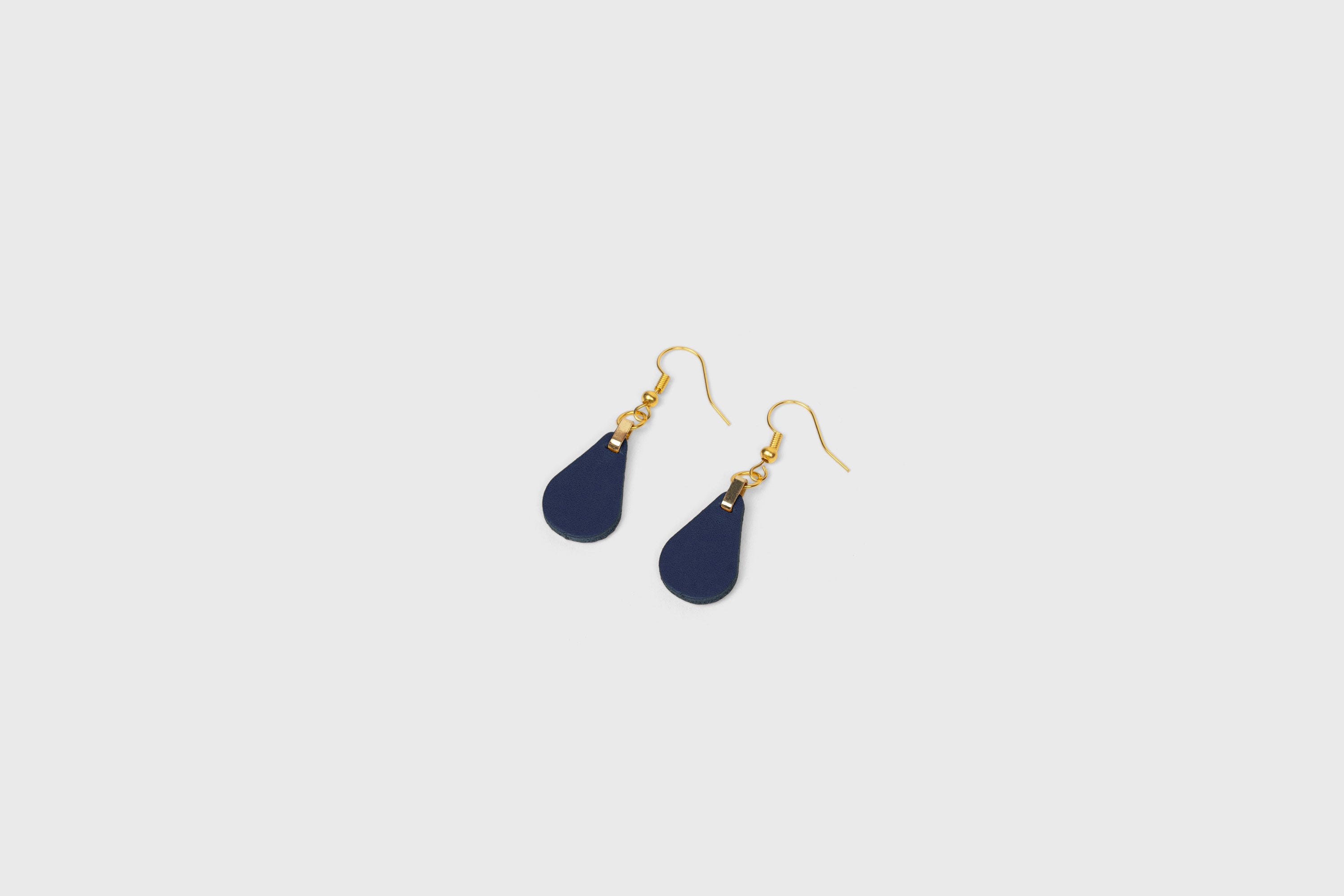 Ona Earrings In Marine Blue Color In Vegetable Tanned Leather Minimalistic Design Atelier Madre Manuel Dreesmann Barcelona Spain