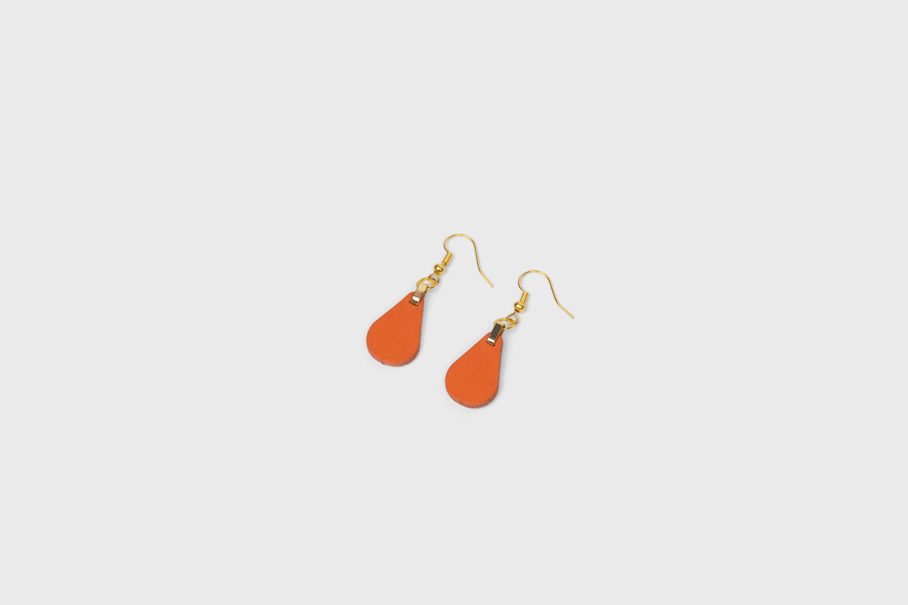 Ona Earrings In Orange Color In Vegetable Tanned Leather Minimalistic Design Atelier Madre Manuel Dreesmann Barcelona Spain