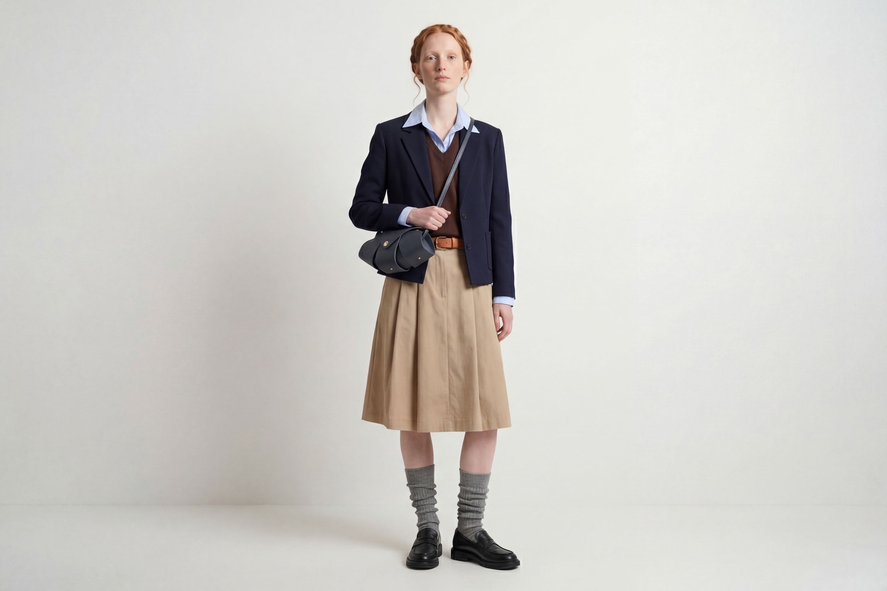 Panino Bag Marine Blue Leather On A Model Magnetic Closure Full Grain Vegetable Tanned Leather High Quality Modern Minimalistic Design Atelier Madre Manuel Dreesmann Barcelona Spain