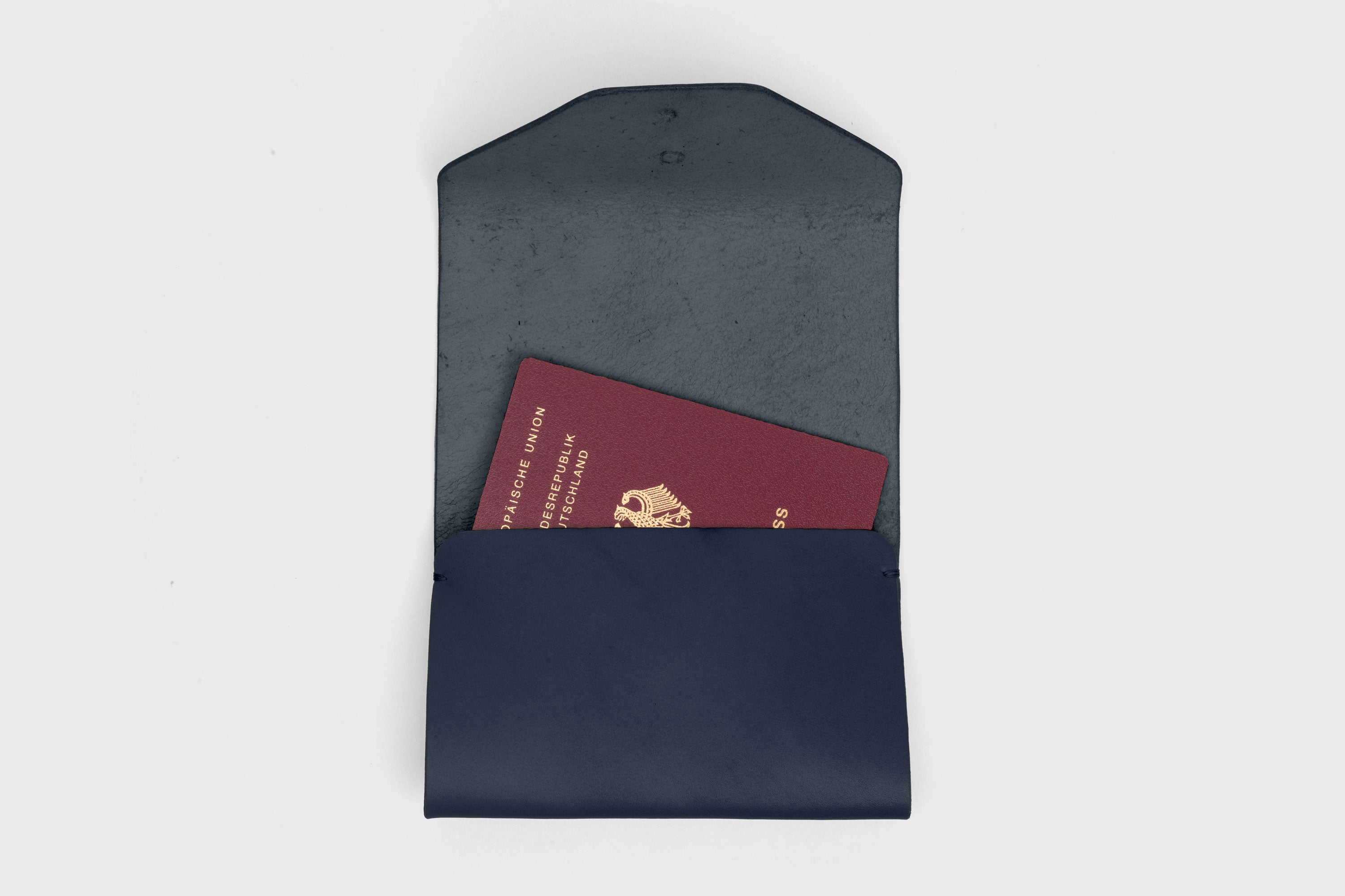 Passport Holder In Marine Blue Color In Vegetable Tanned Leather Minimalistic Design Premium Quality Atelier Madre Manuel Dreesmann Barcelona Spain