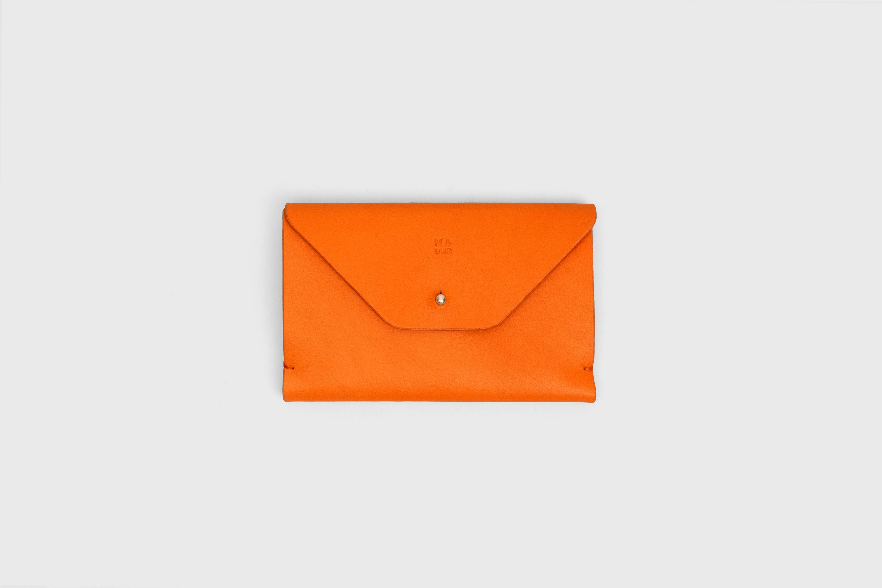 Passport Holder In Orange Color In Vegetable Tanned Leather Minimalistic Design Premium Quality Atelier Madre Manuel Dreesmann Barcelona Spain