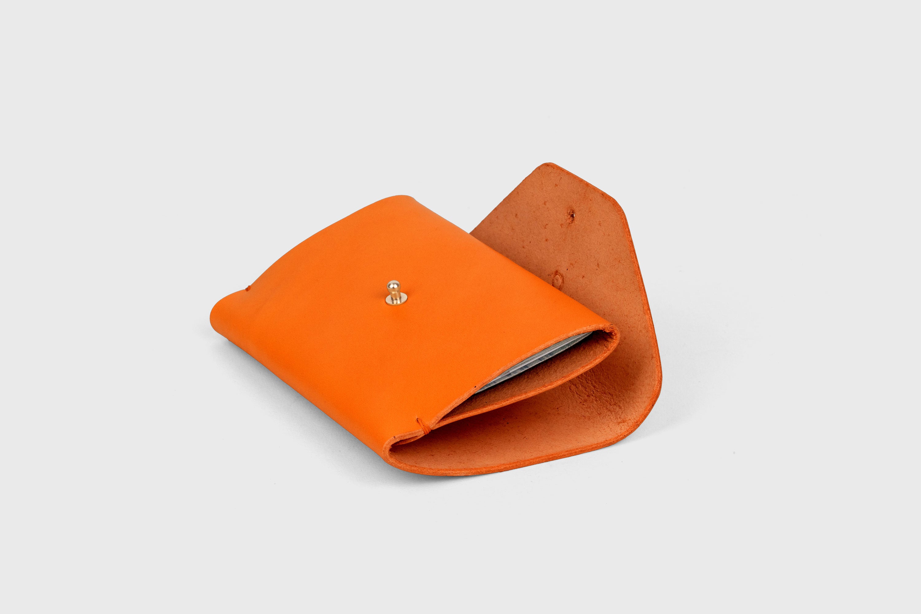 Passport Holder In Orange Color In Vegetable Tanned Leather Minimalistic Design Premium Quality Atelier Madre Manuel Dreesmann Barcelona Spain