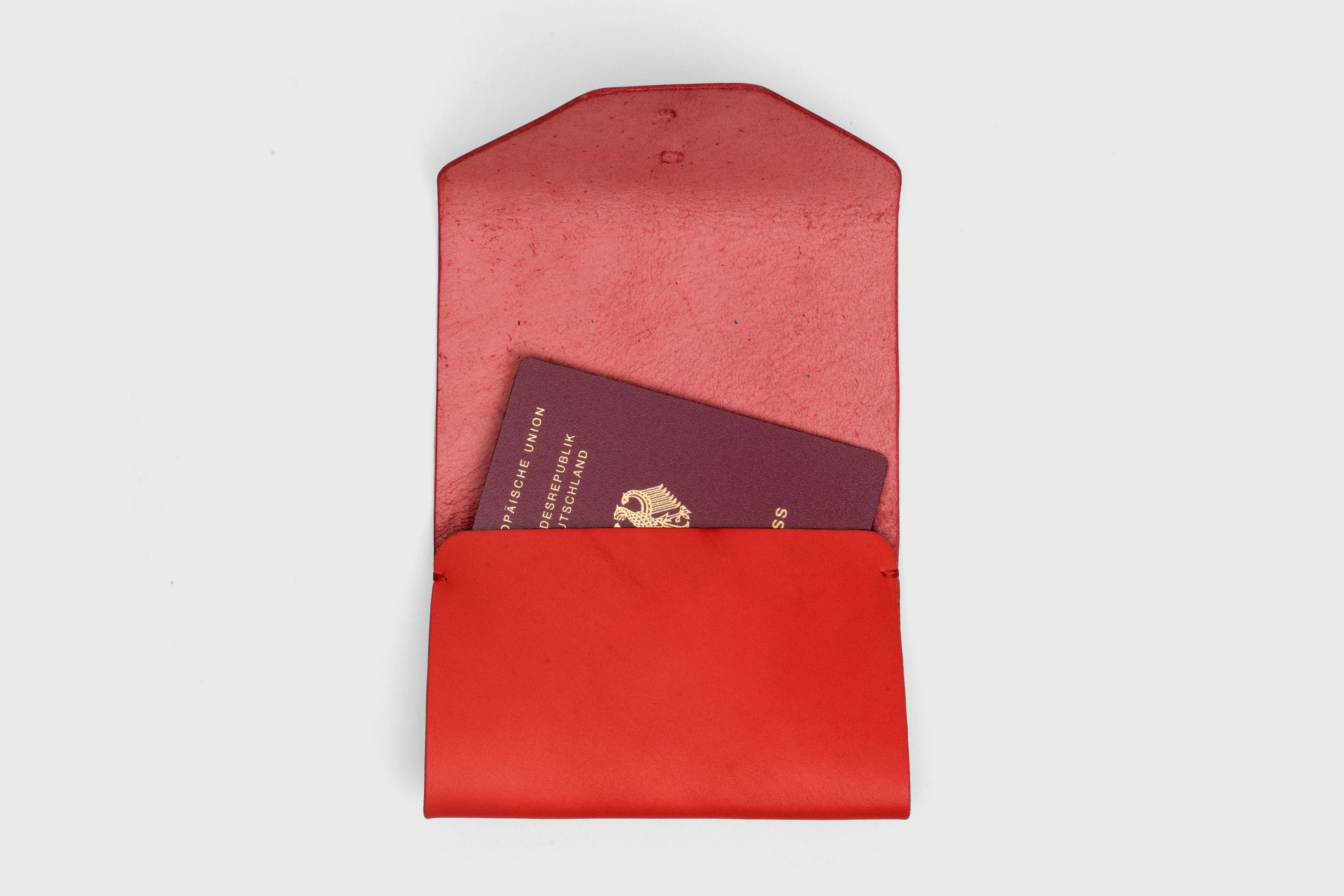 Passport Holder In Red Color In Vegetable Tanned Leather Minimalistic Design Premium Quality Atelier Madre Manuel Dreesmann Barcelona Spain