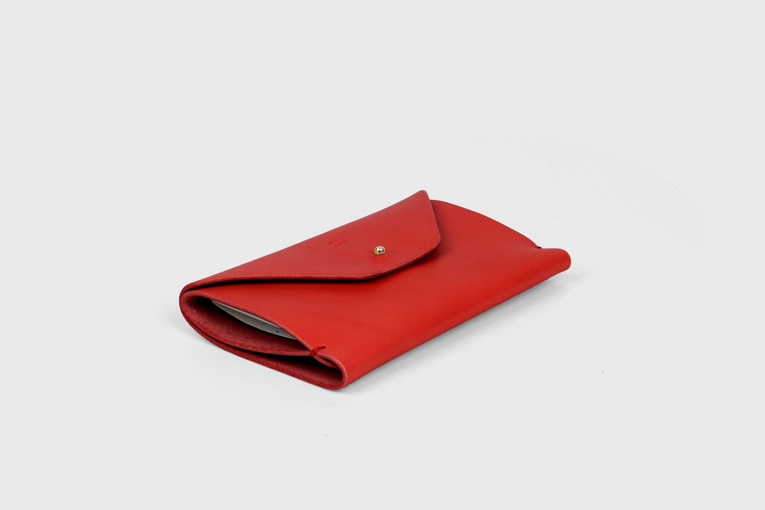Passport Holder In Red Color In Vegetable Tanned Leather Minimalistic Design Premium Quality Atelier Madre Manuel Dreesmann Barcelona Spain