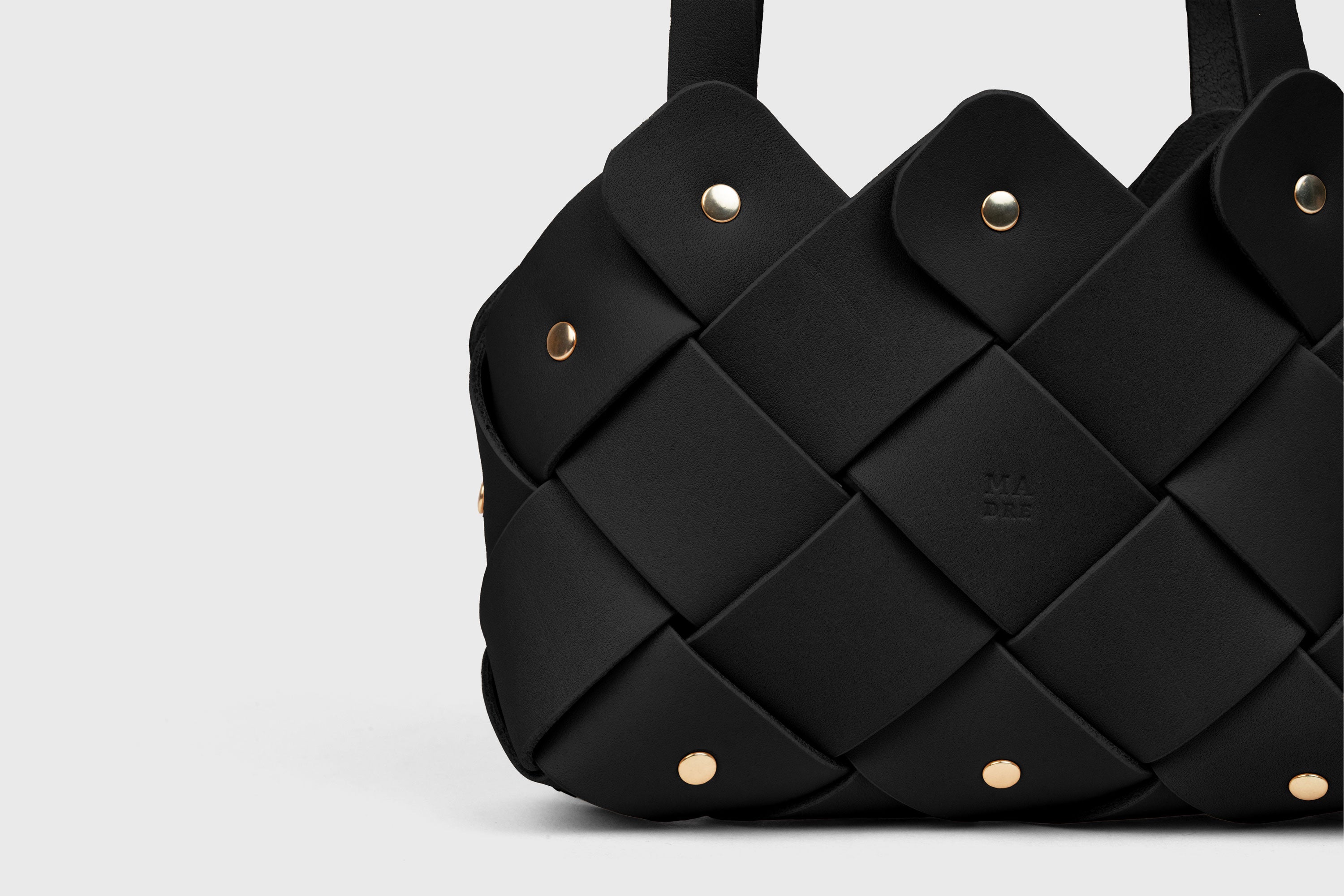 Pine Mini Tote Bag In Black Color In Vegetable Tanned Leather Woven Technique and Brass Rivets Atelier Madre Manuel Dreesmann Barcelona Spain