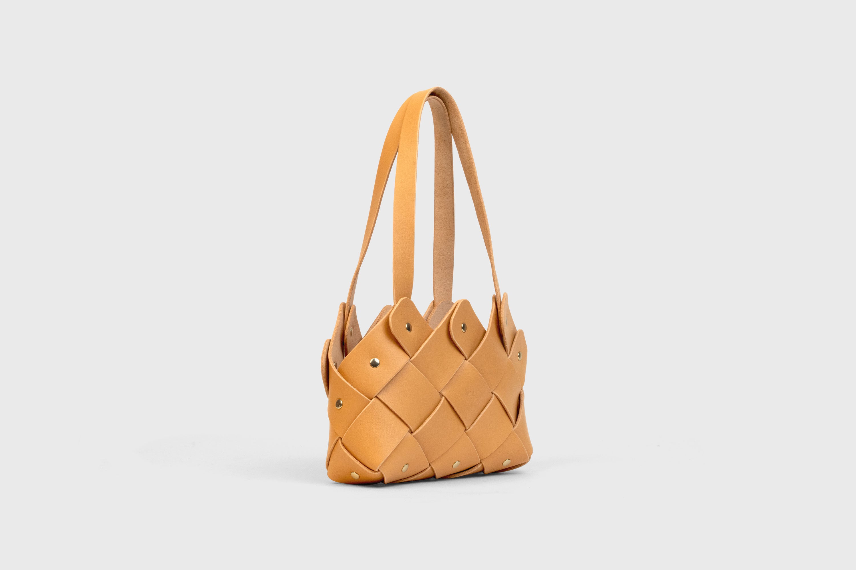 Pine Mini Tote Bag In Brown Color In Vegetable Tanned Leather Woven Technique and Brass Rivets Atelier Madre Manuel Dreesmann Barcelona Spain