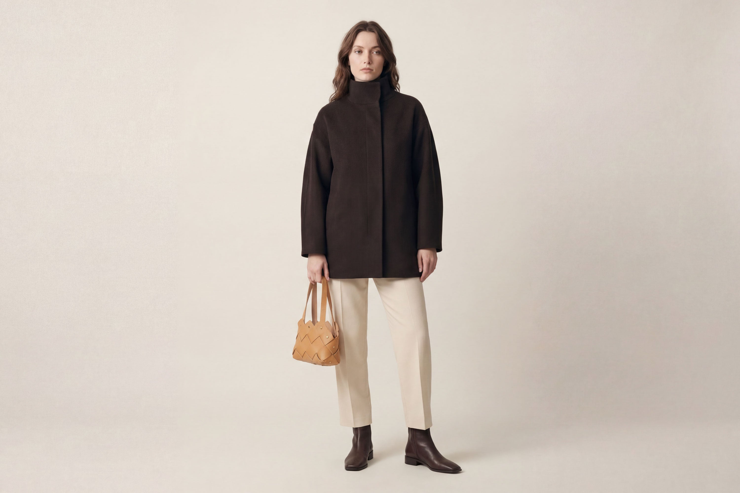 Pine Mini Tote Bag In Brown Color In Vegetable Tanned Leather On Woman Model Woven Technique and Brass Rivets Atelier Madre Manuel Dreesmann Barcelona Spain