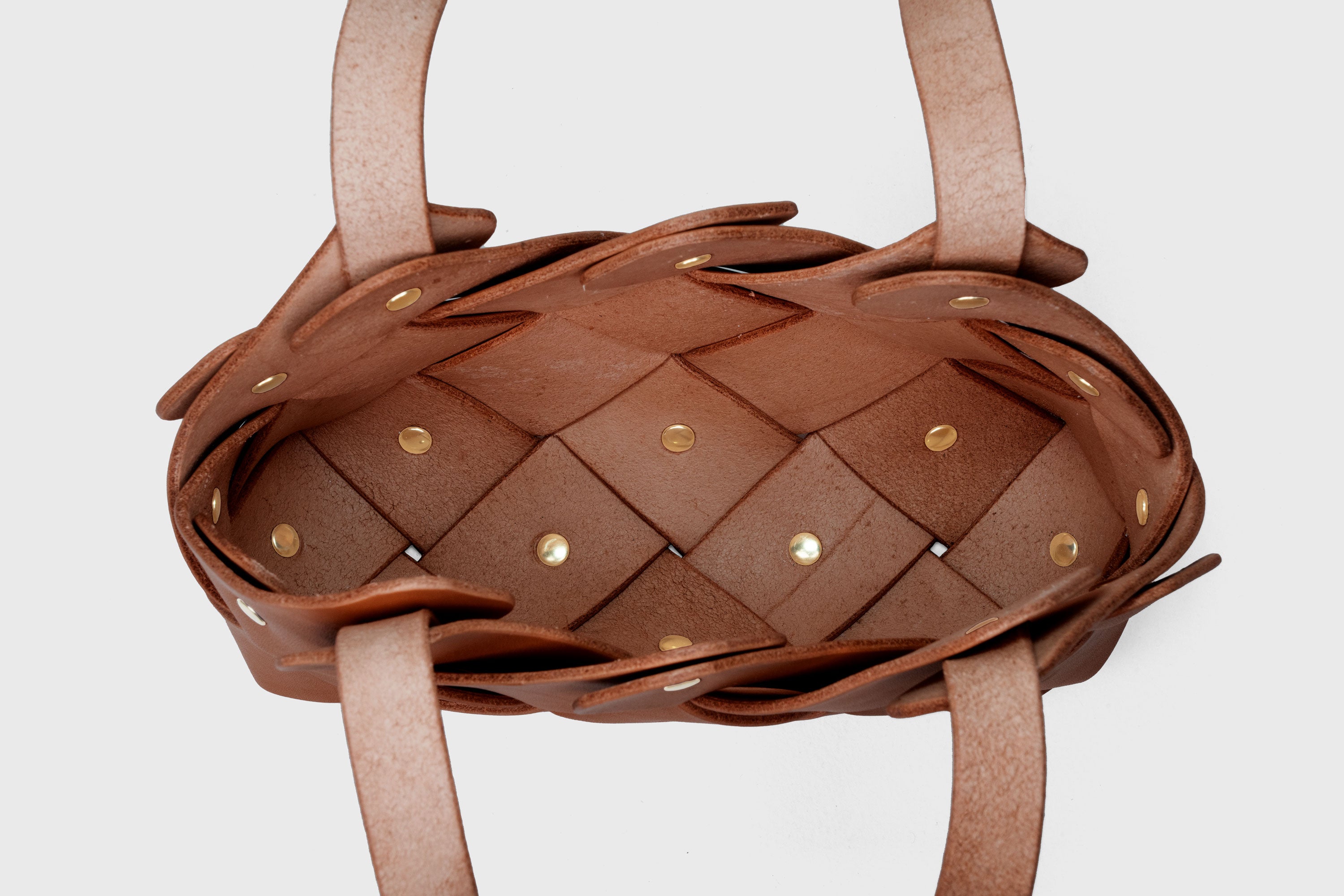 Pine Mini Tote Bag In Dark Brown Color In Vegetable Tanned Leather Woven Technique and Brass Rivets Atelier Madre Manuel Dreesmann Barcelona Spain