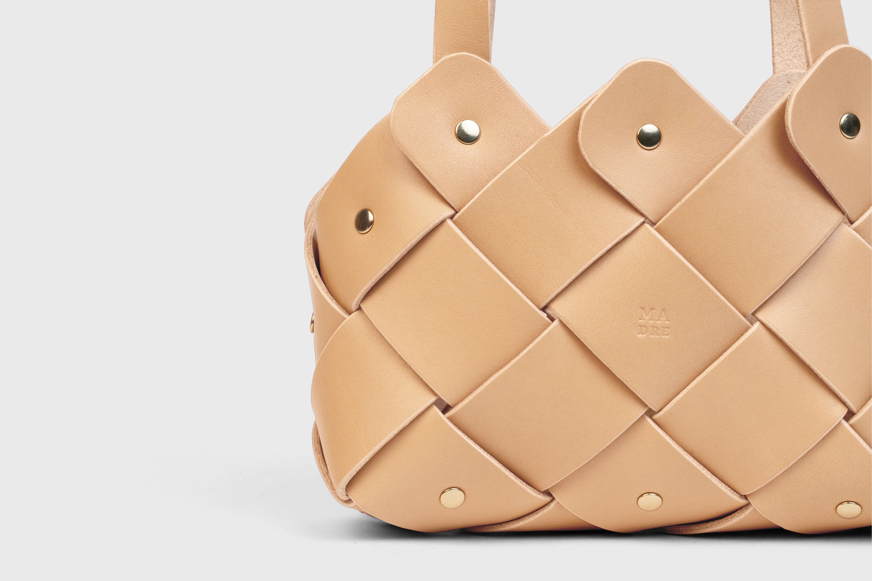 Pine Mini Tote Bag In Natural Color In Vegetable Tanned Leather Woven Technique and Brass Rivets Atelier Madre Manuel Dreesmann Barcelona Spain