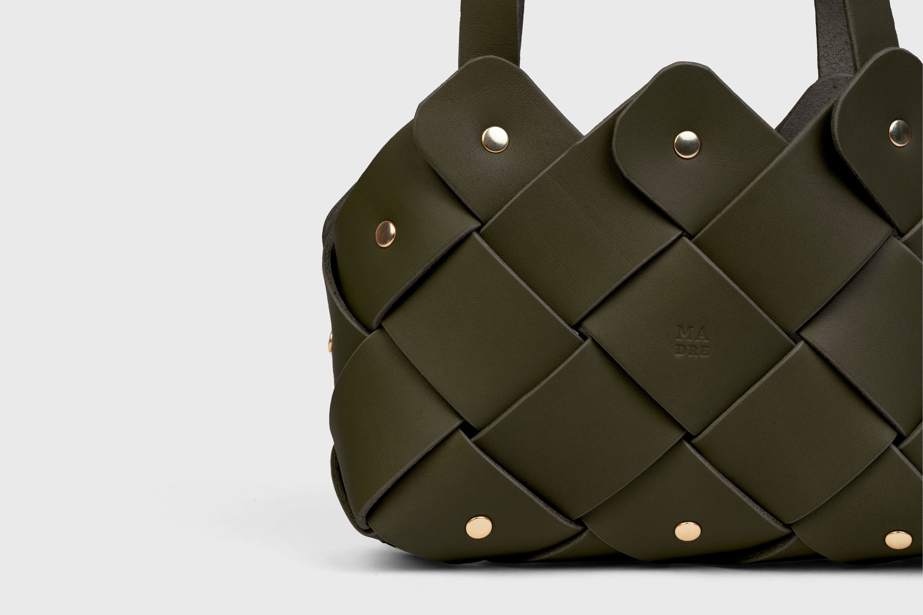 Pine Mini Tote Bag In Olive Green Color In Vegetable Tanned Leather Woven Technique and Brass Rivets Atelier Madre Manuel Dreesmann Barcelona Spain