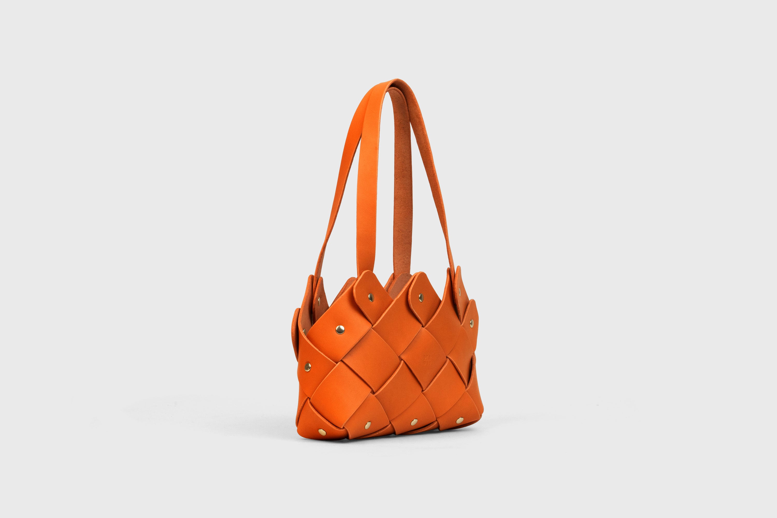 Pine Mini Tote Bag In Orange Color In Vegetable Tanned Leather Woven Technique and Brass Rivets Atelier Madre Manuel Dreesmann Barcelona Spain