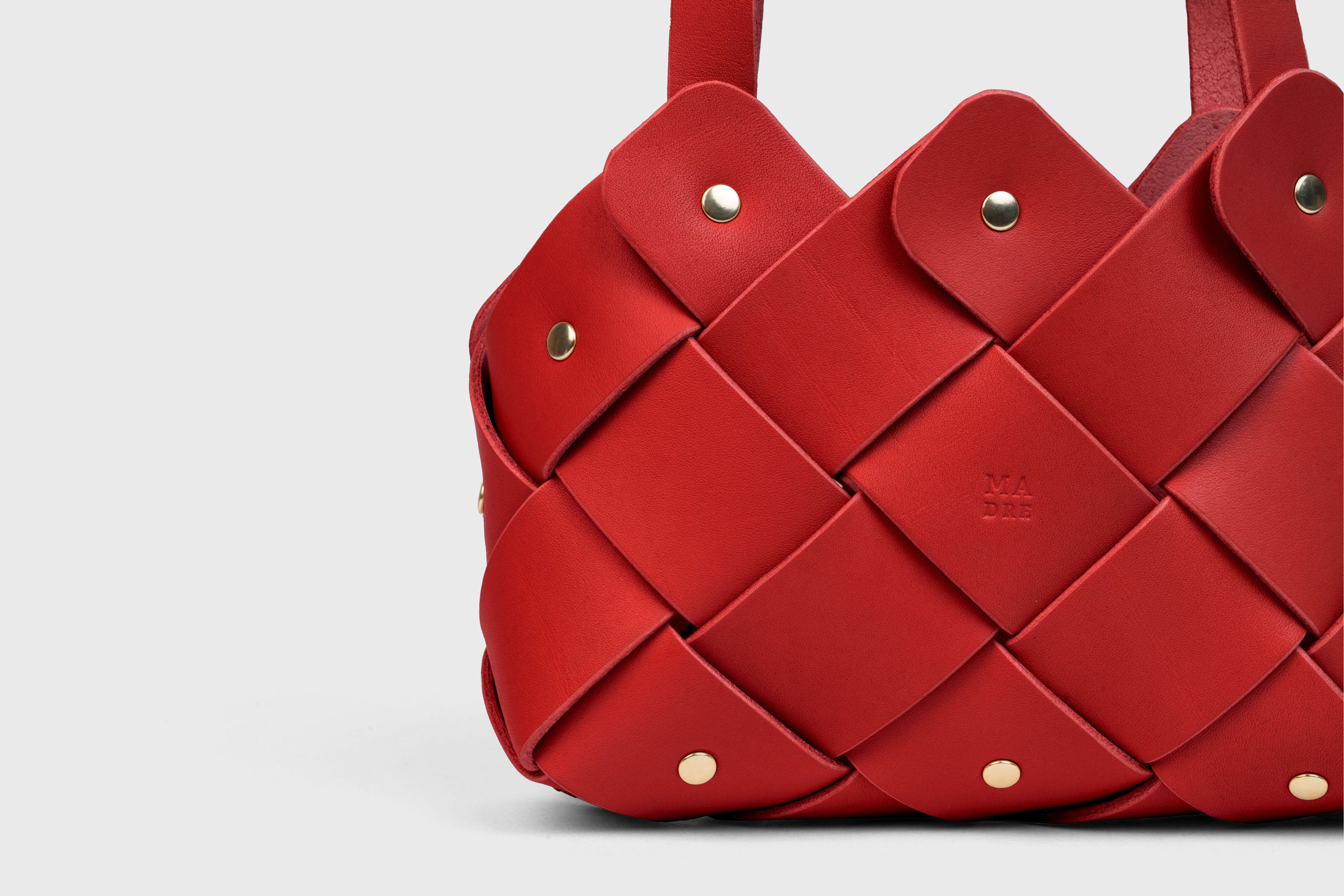 Pine Mini Tote Bag In Red Color In Vegetable Tanned Leather Woven Technique and Brass Rivets Atelier Madre Manuel Dreesmann Barcelona Spain