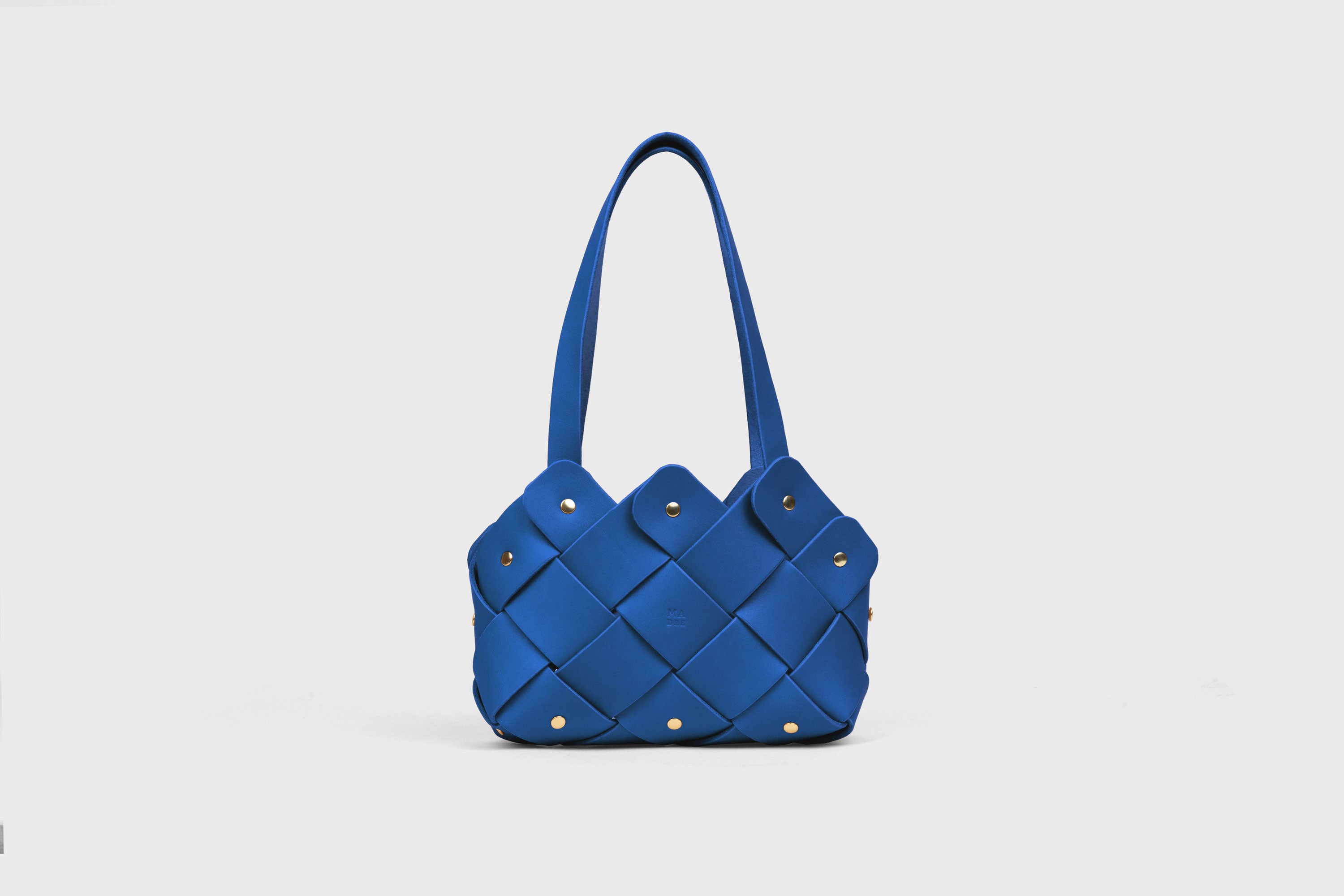 Pine Mini Tote Bag In Royal Blue Color In Vegetable Tanned Leather Woven Technique and Brass Rivets Atelier Madre Manuel Dreesmann Barcelona Spain