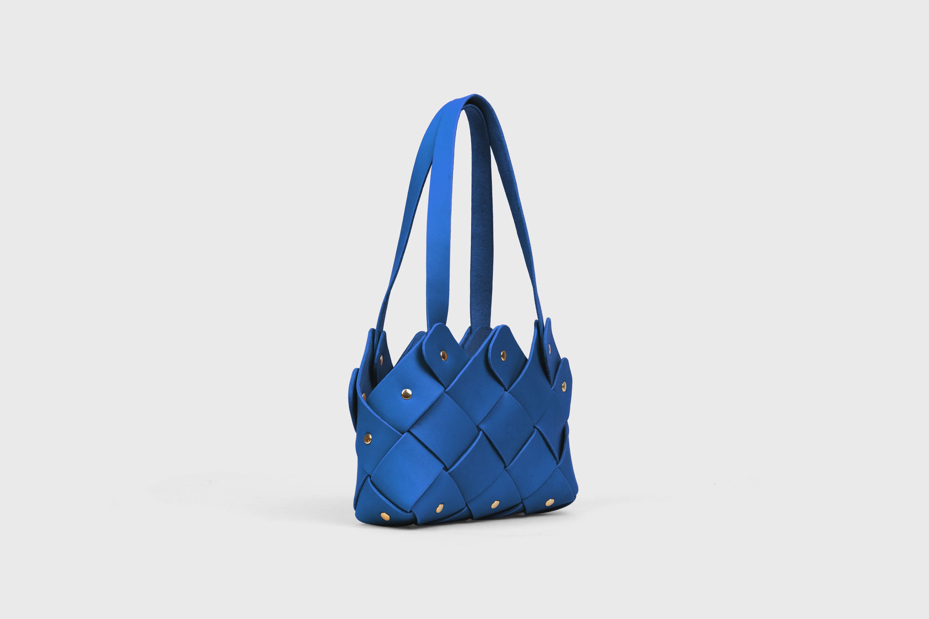 Pine Mini Tote Bag In Royal Blue Color In Vegetable Tanned Leather Woven Technique and Brass Rivets Atelier Madre Manuel Dreesmann Barcelona Spain