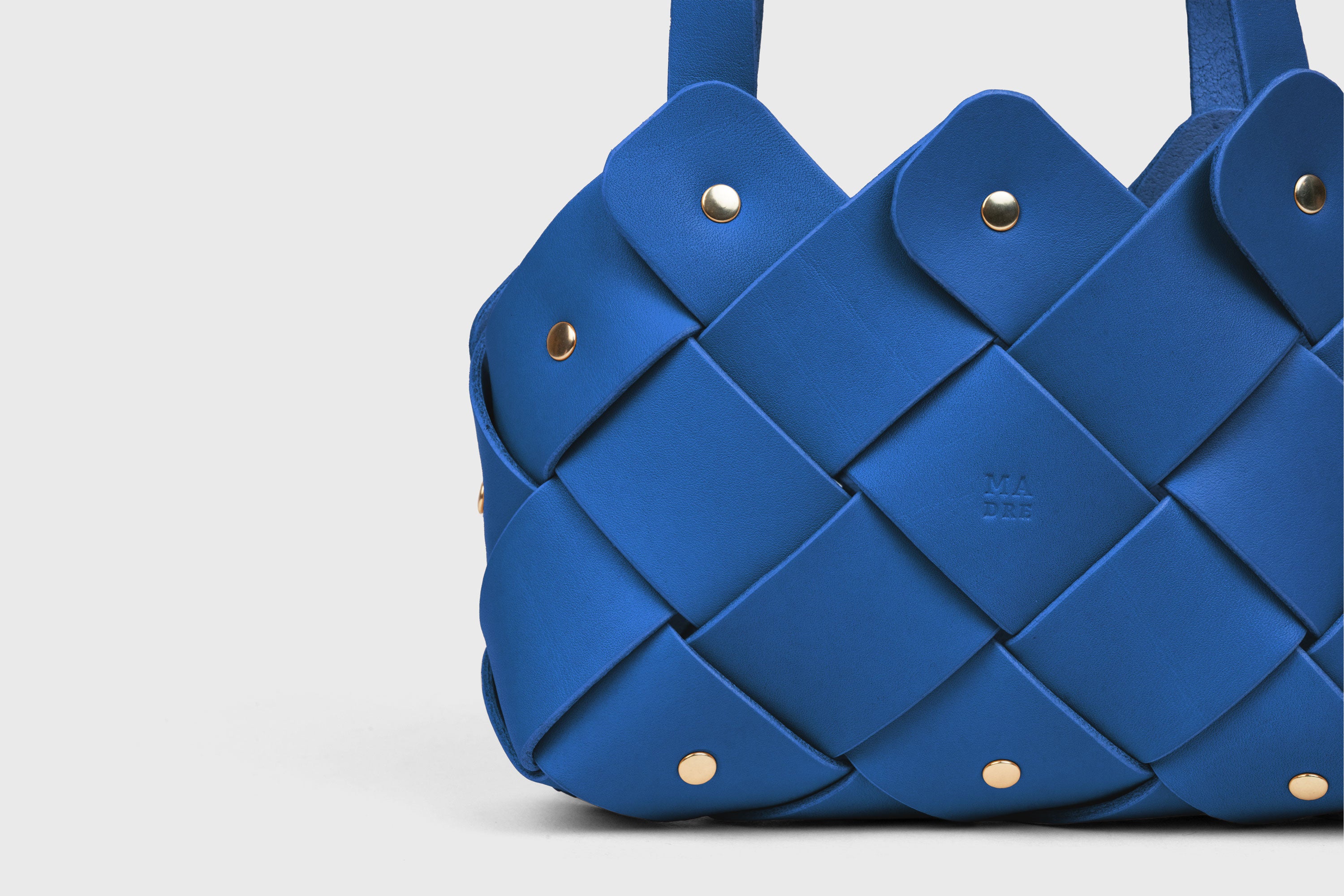 Pine Mini Tote Bag In Royal Blue Color In Vegetable Tanned Leather Woven Technique and Brass Rivets Atelier Madre Manuel Dreesmann Barcelona Spain