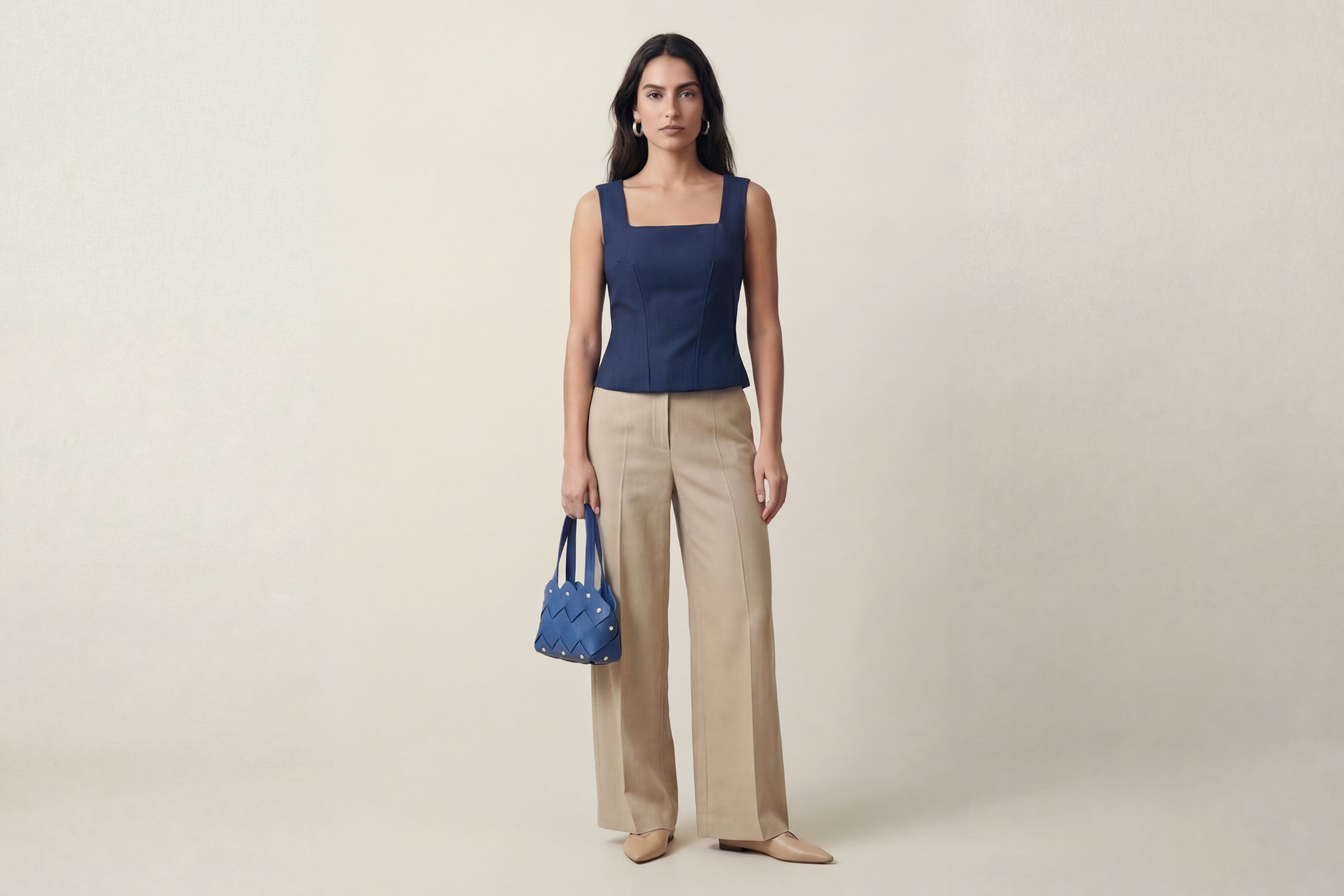 Pine Mini Tote Bag In Royal Blue Color In Vegetable Tanned Leather On Woman Model Woven Technique and Brass Rivets Atelier Madre Manuel Dreesmann Barcelona Spain