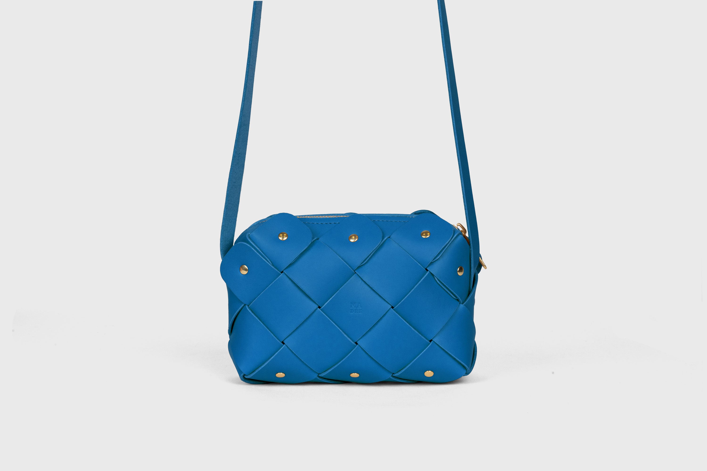 Pine Mini ZIpper Bag in Royal Blue Color In Vegetable Tanned Leather Unique Design Brass RIvets Atelier Madre Manuel Dreesmann Barcelona Spain