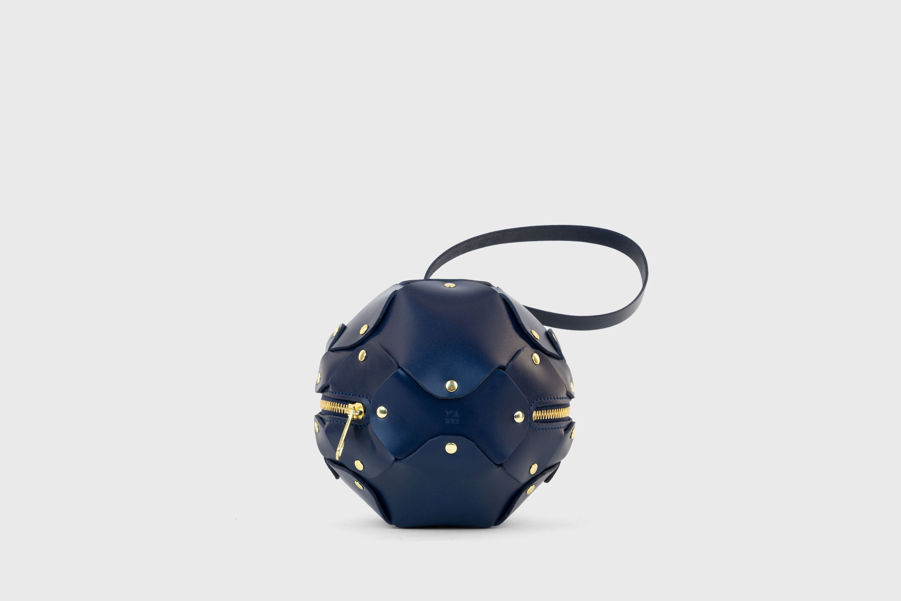Puff Leather Ball Bag Dark Marine Blue Color Luxury Vegetable Tanned Full Grain Spain Brass Rivets Premium Design Minimalist Modern Round Sphere Circle Round Zipper Pouch Handbag Clutch Bag Atelier Madre Manuel Dreesmann Barcelona