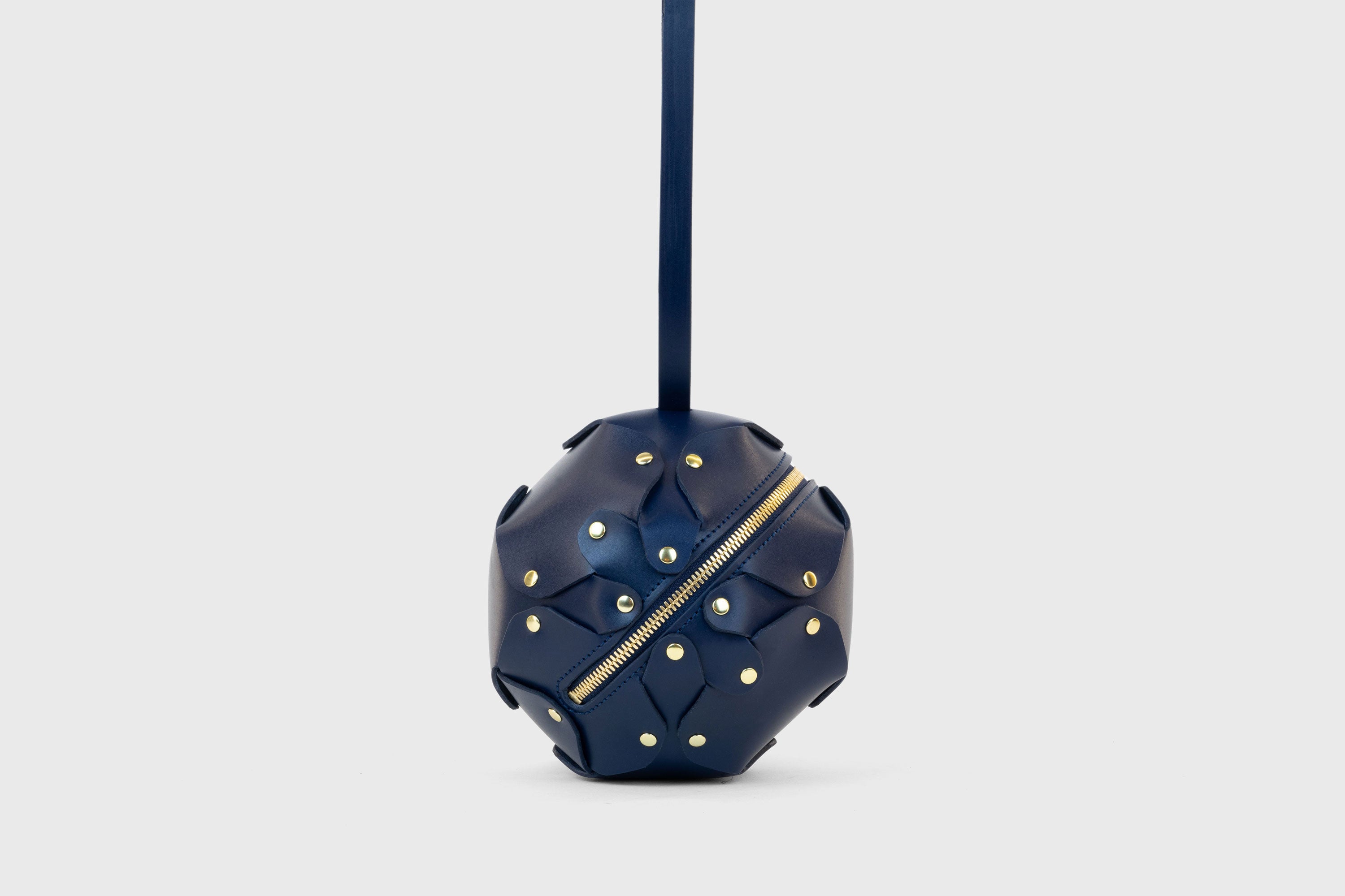 Puff Leather Ball Bag Dark Marine Blue Color Luxury Vegetable Tanned Full Grain Spain Brass Rivets Premium Design Minimalist Modern Round Sphere Circle Round Zipper Pouch Handbag Clutch Bag Atelier Madre Manuel Dreesmann Barcelona