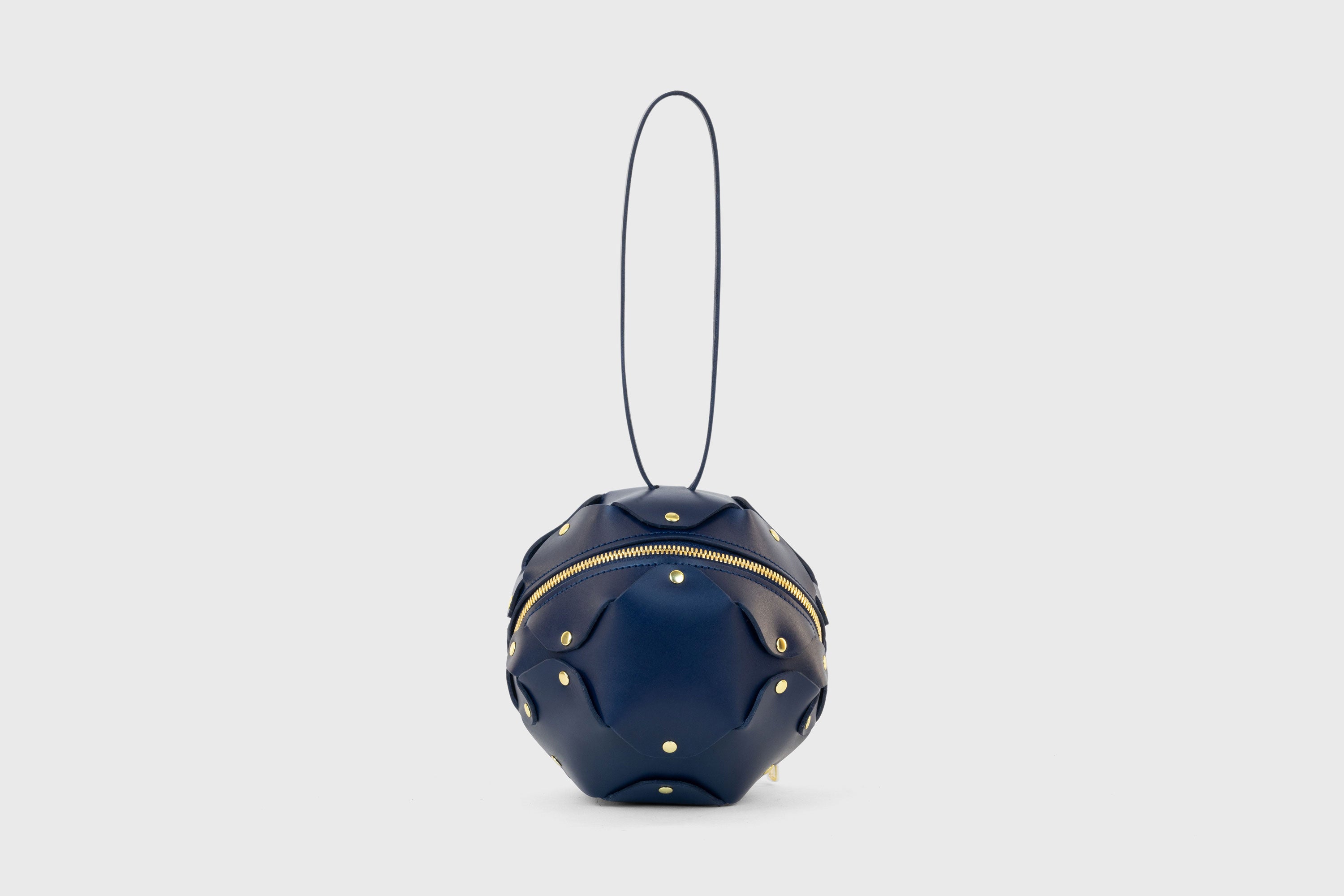 Puff Leather Ball Bag Dark Marine Blue Color Luxury Vegetable Tanned Full Grain Spain Brass Rivets Premium Design Minimalist Modern Round Sphere Circle Round Zipper Pouch Handbag Clutch Bag Atelier Madre Manuel Dreesmann Barcelona