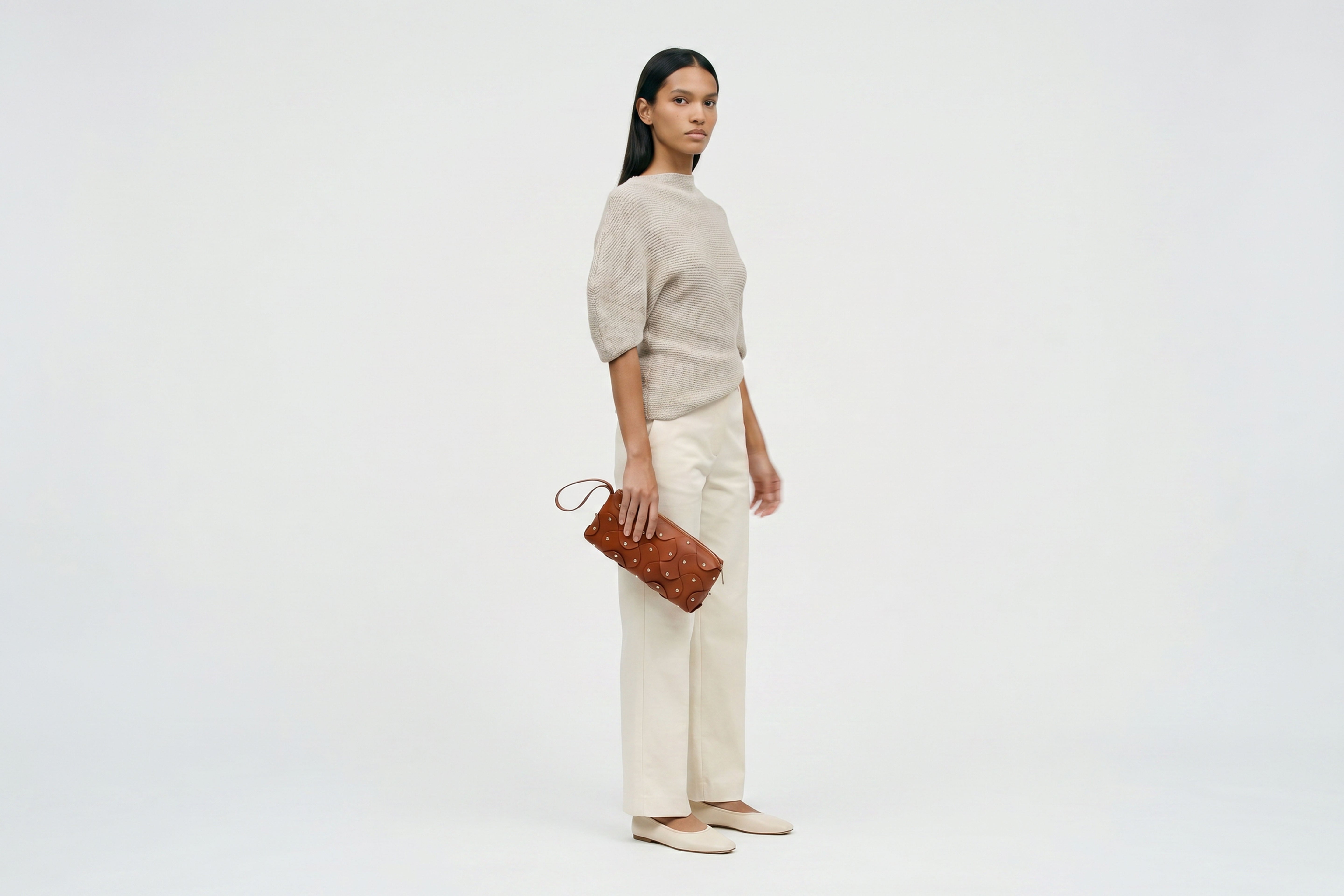 Rivet Bag 01 In Dark Brown Color On A Woman Model In Vegetable Tanned Leather With Brass Rivets Unique Design Atelier Madre Manuel Dreesmann Barcelona Spain