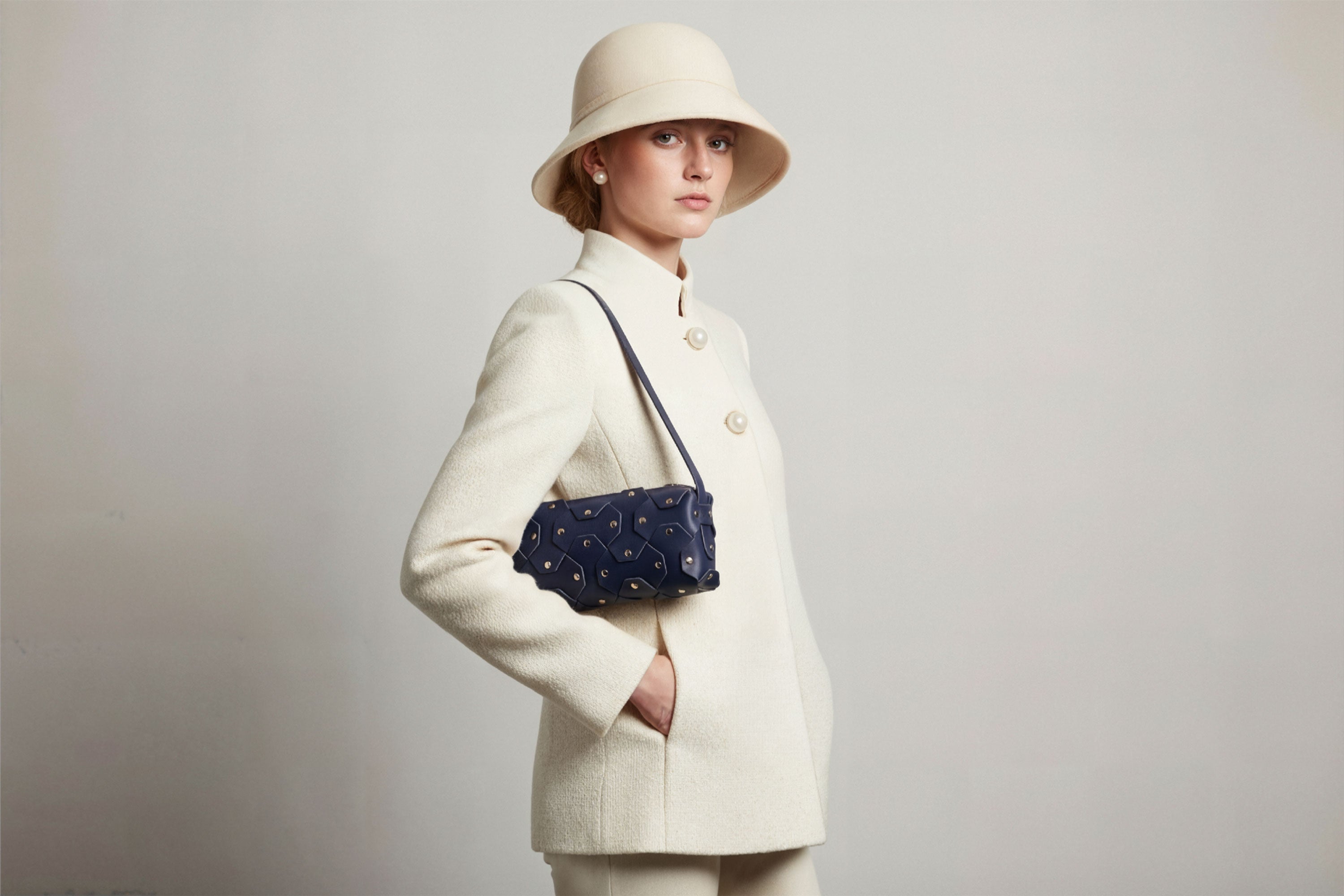 The Rivet Bag Leather Marine Blue Color On A Woman Model Vegetable Tanned Full Grain Leather Premium Quality Handbag Crossbody Shoulder Clutch Minimalistic Modern Design Atelier Madre Manuel Dreesmann Barcelona Spain