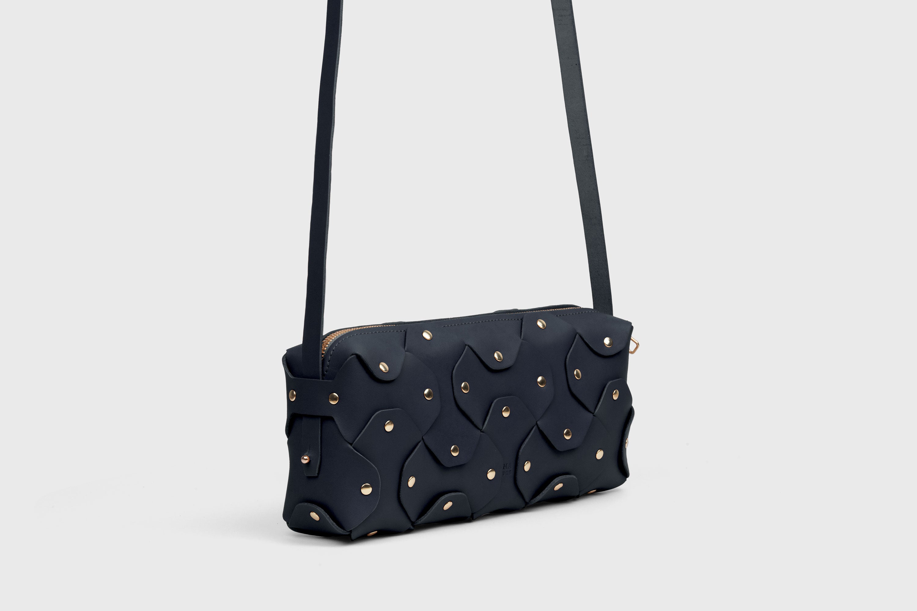Rivet Bag 01 In Marine Blue Color In Vegetable Tanned Leather With Brass Rivets Unique Design Atelier Madre Manuel Dreesmann Barcelona Spain