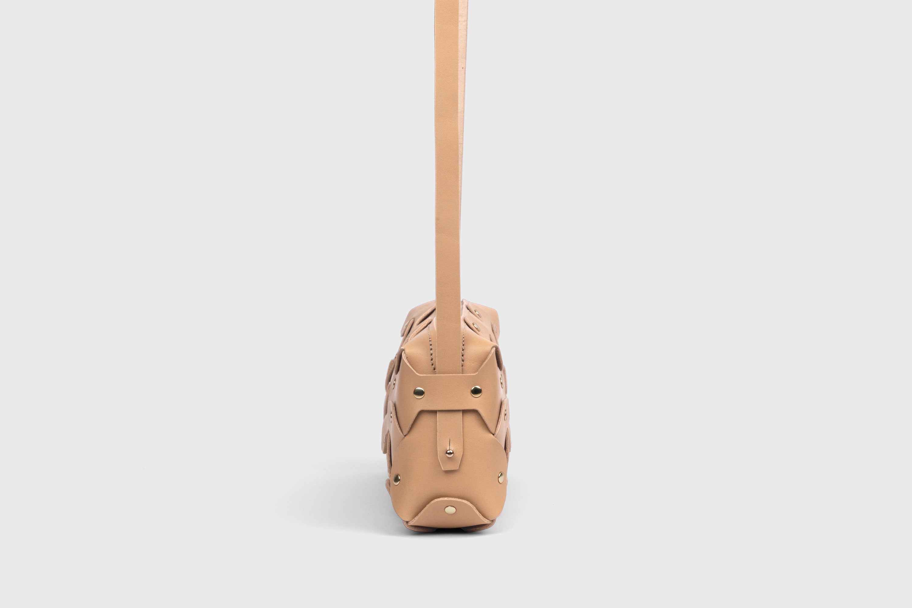 Rivet Bag 01 In Natural Color In Vegetable Tanned Leather With Brass Rivets Unique Design Atelier Madre Manuel Dreesmann Barcelona Spain
