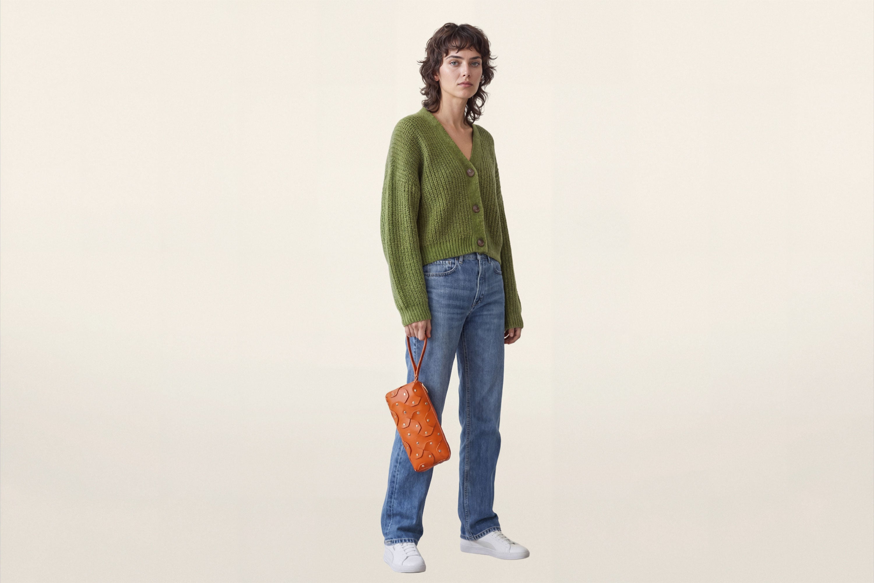 The Rivet Bag Leather Orange Color On A Woman Model Vegetable Tanned Full Grain Leather Premium Quality Handbag Crossbody Shoulder Clutch Minimalistic Modern Design Atelier Madre Manuel Dreesmann Barcelona Spain