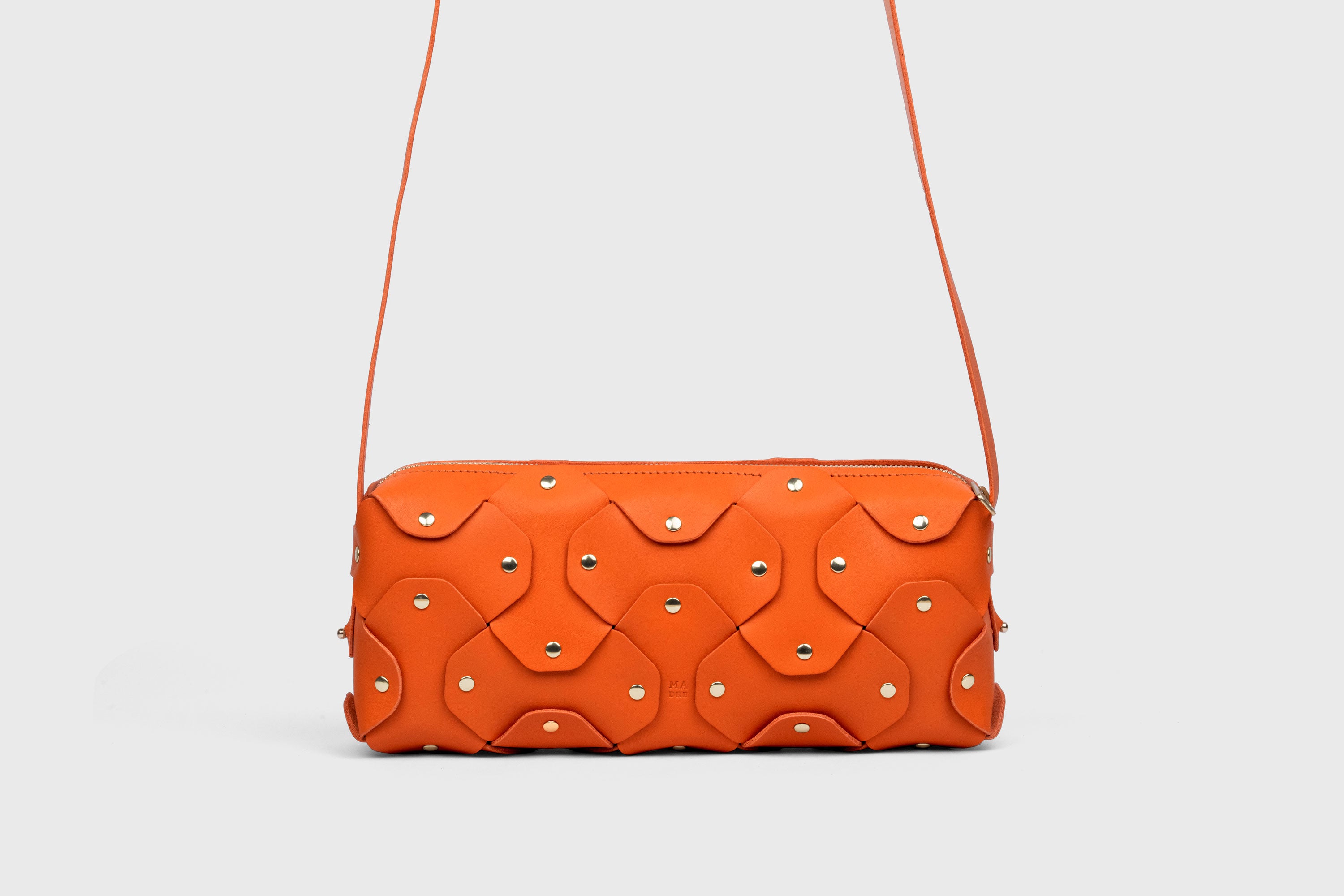 Rivet Bag 01 In Orange Color In Vegetable Tanned Leather With Brass Rivets Unique Design Atelier Madre Manuel Dreesmann Barcelona Spain