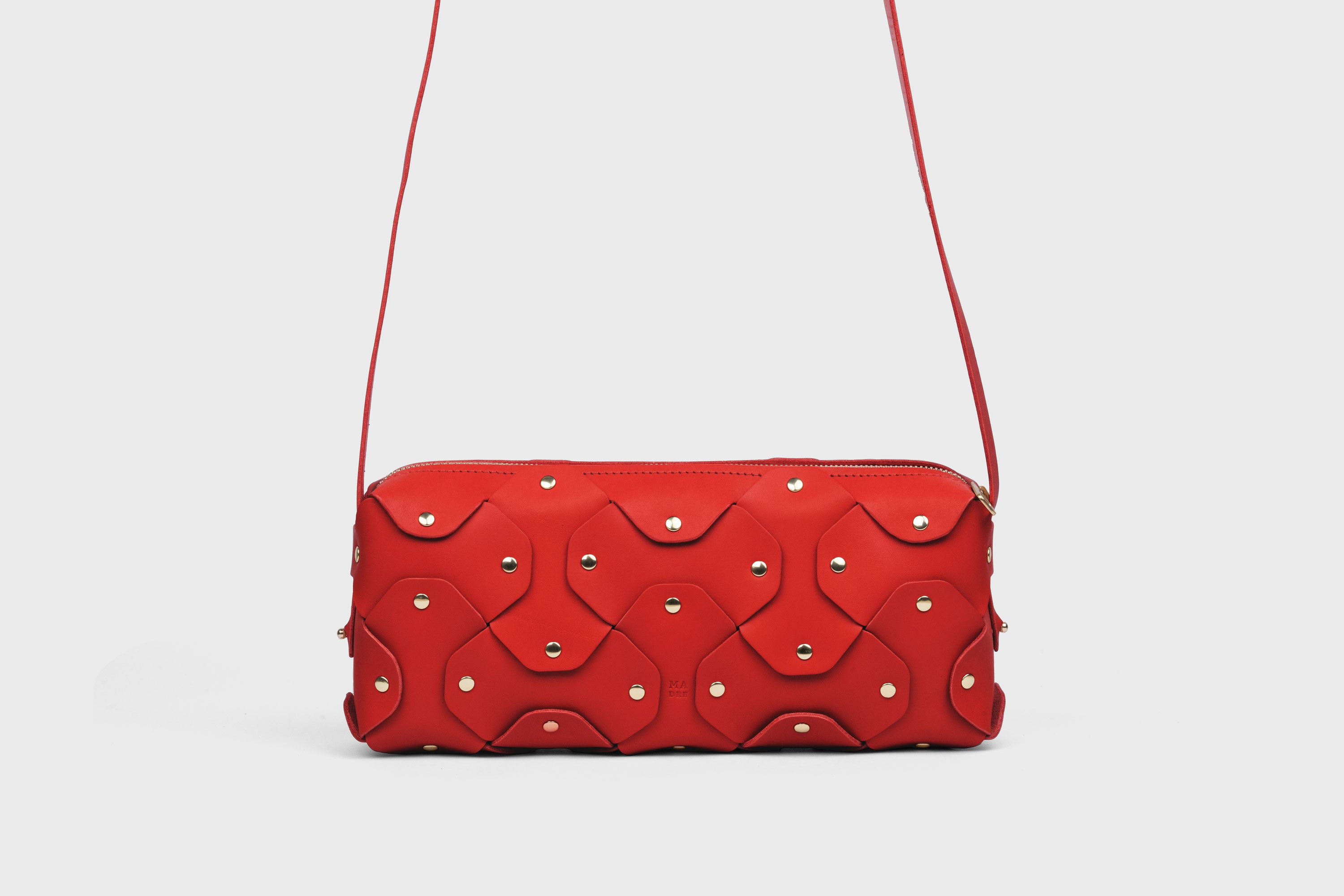 Rivet Bag 01 In Red Color In Vegetable Tanned Leather With Brass Rivets Unique Design Atelier Madre Manuel Dreesmann Barcelona Spain