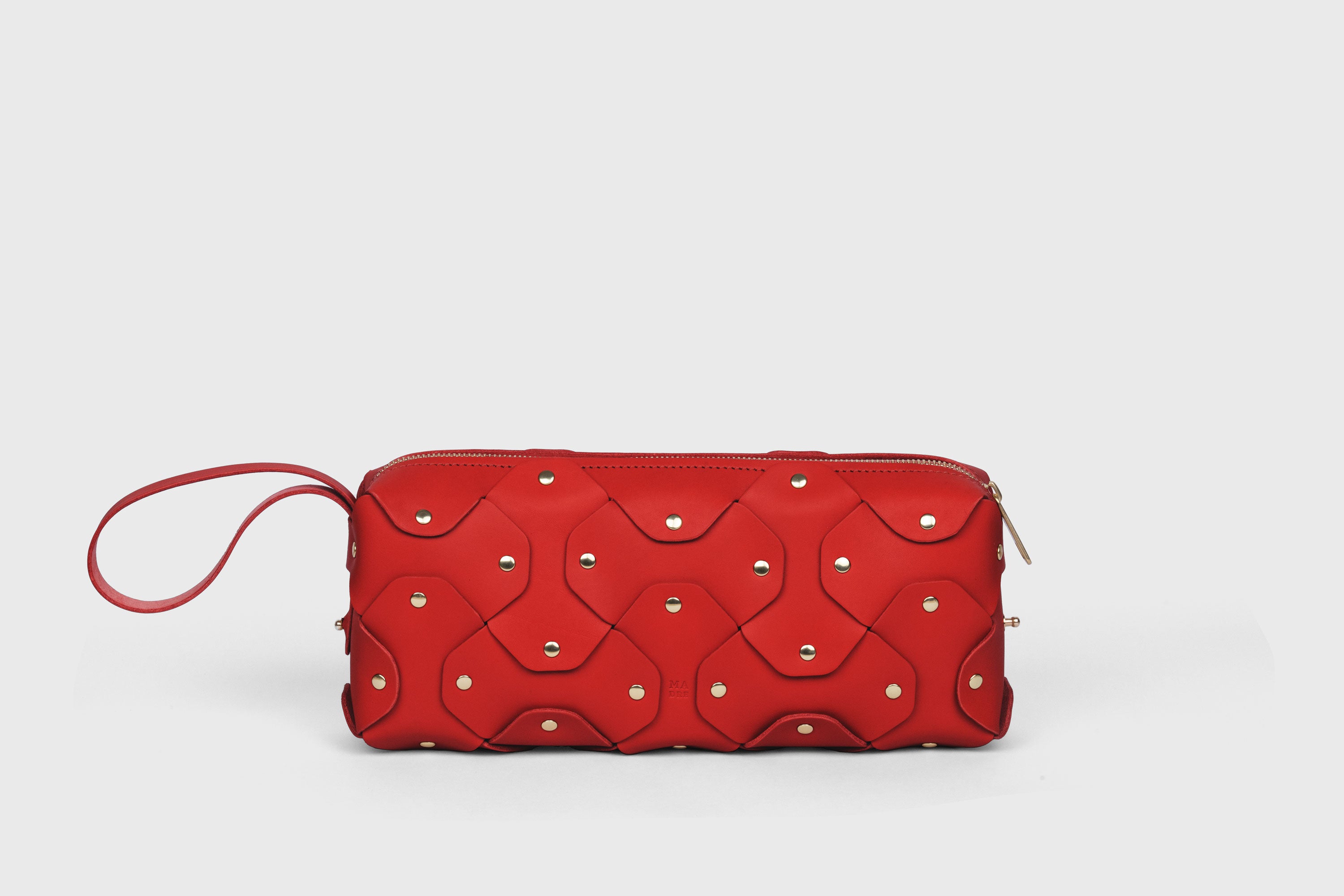 Rivet Bag 01 In Red Color In Vegetable Tanned Leather With Brass Rivets Unique Design Atelier Madre Manuel Dreesmann Barcelona Spain