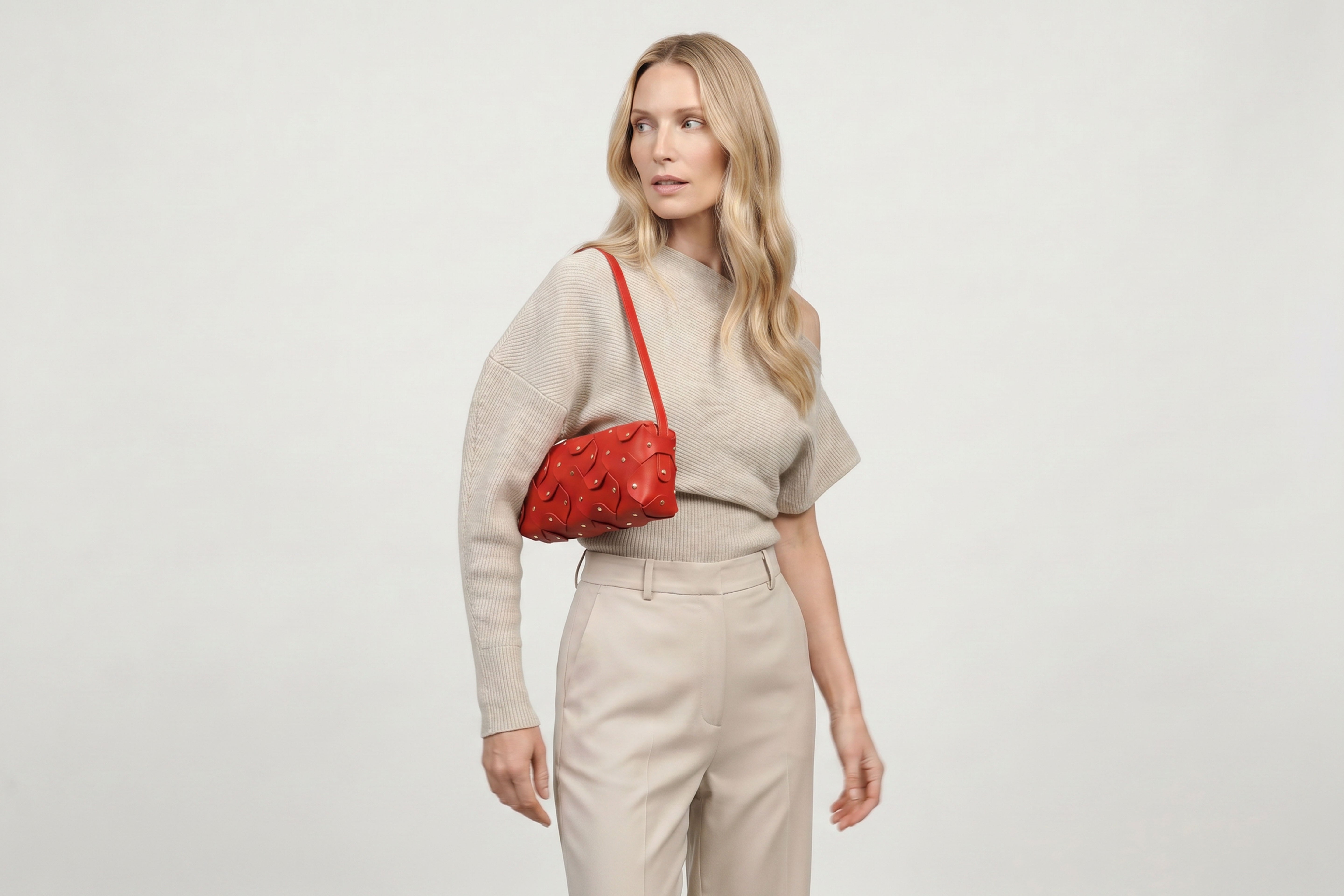 Rivet Bag 01 In Red Color On A Woman Model In Vegetable Tanned Leather With Brass Rivets Unique Design Atelier Madre Manuel Dreesmann Barcelona Spain
