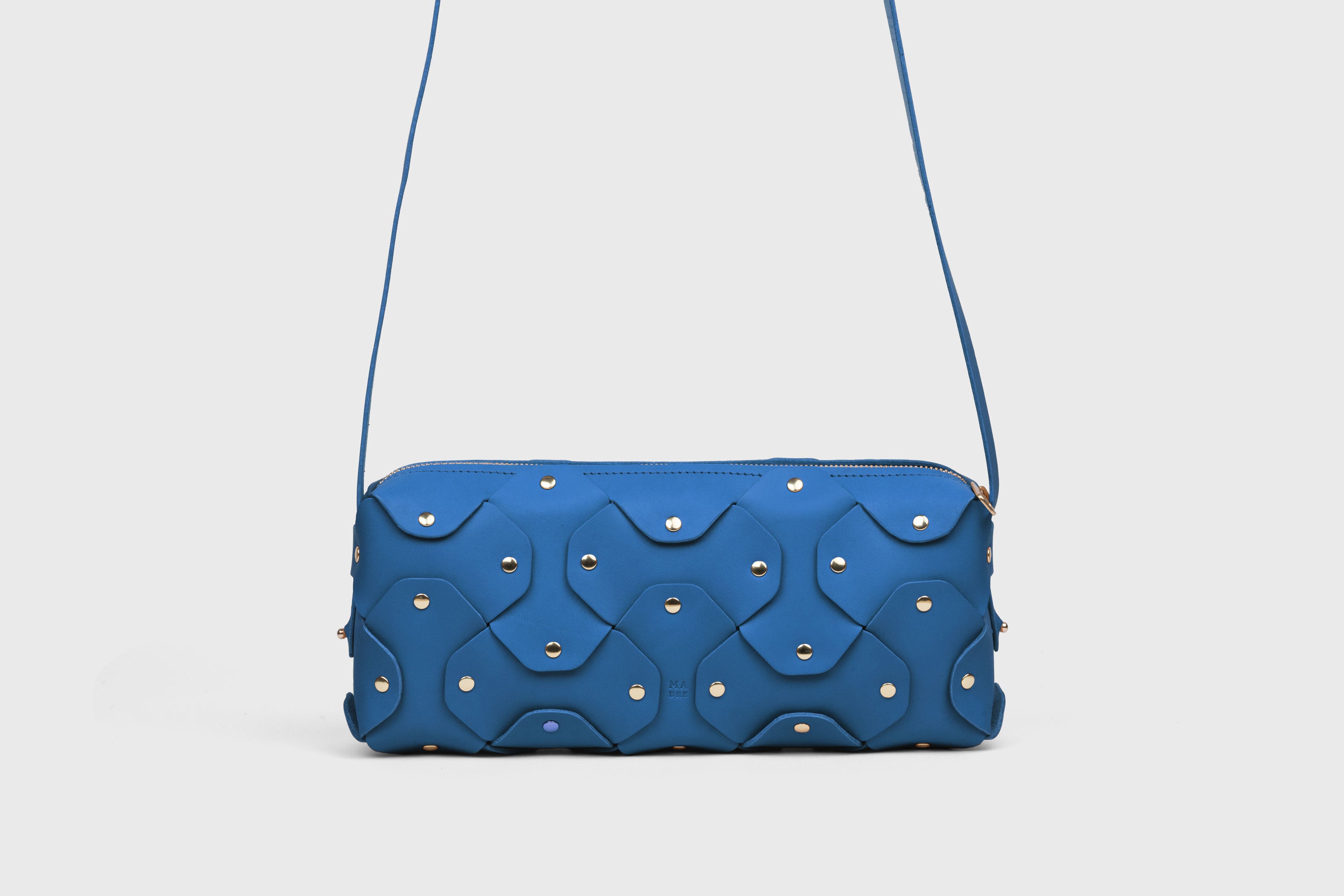Rivet Bag 01 In Royal Blue Color In Vegetable Tanned Leather With Brass Rivets Unique Design Atelier Madre Manuel Dreesmann Barcelona Spain