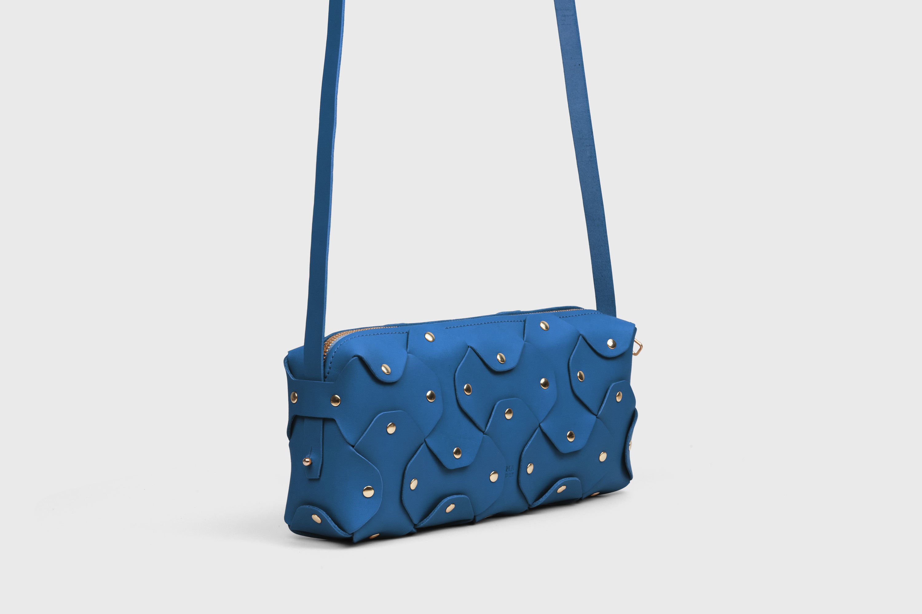 Rivet Bag 01 In Royal Blue Color In Vegetable Tanned Leather With Brass Rivets Unique Design Atelier Madre Manuel Dreesmann Barcelona Spain