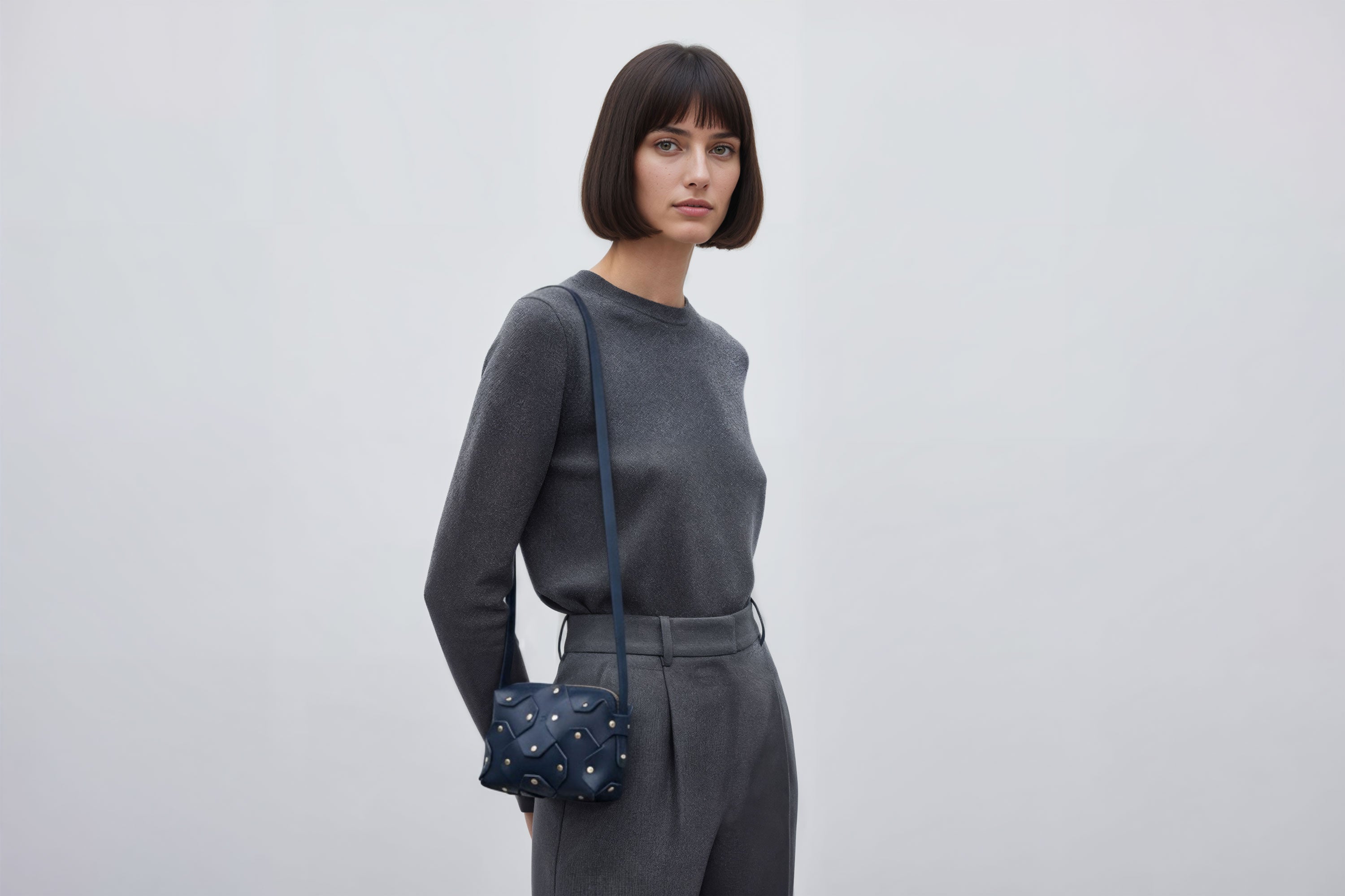 Rivet Bag Small Leather Marine Blue Color Clutch On Model Crossbody Shoulder Detachable Full Brass Vegetable Tanned Full Grain Leather High Quality Modern Minimalistic Design Atelier Madre Manuel Dreesmann Barcelona Spain