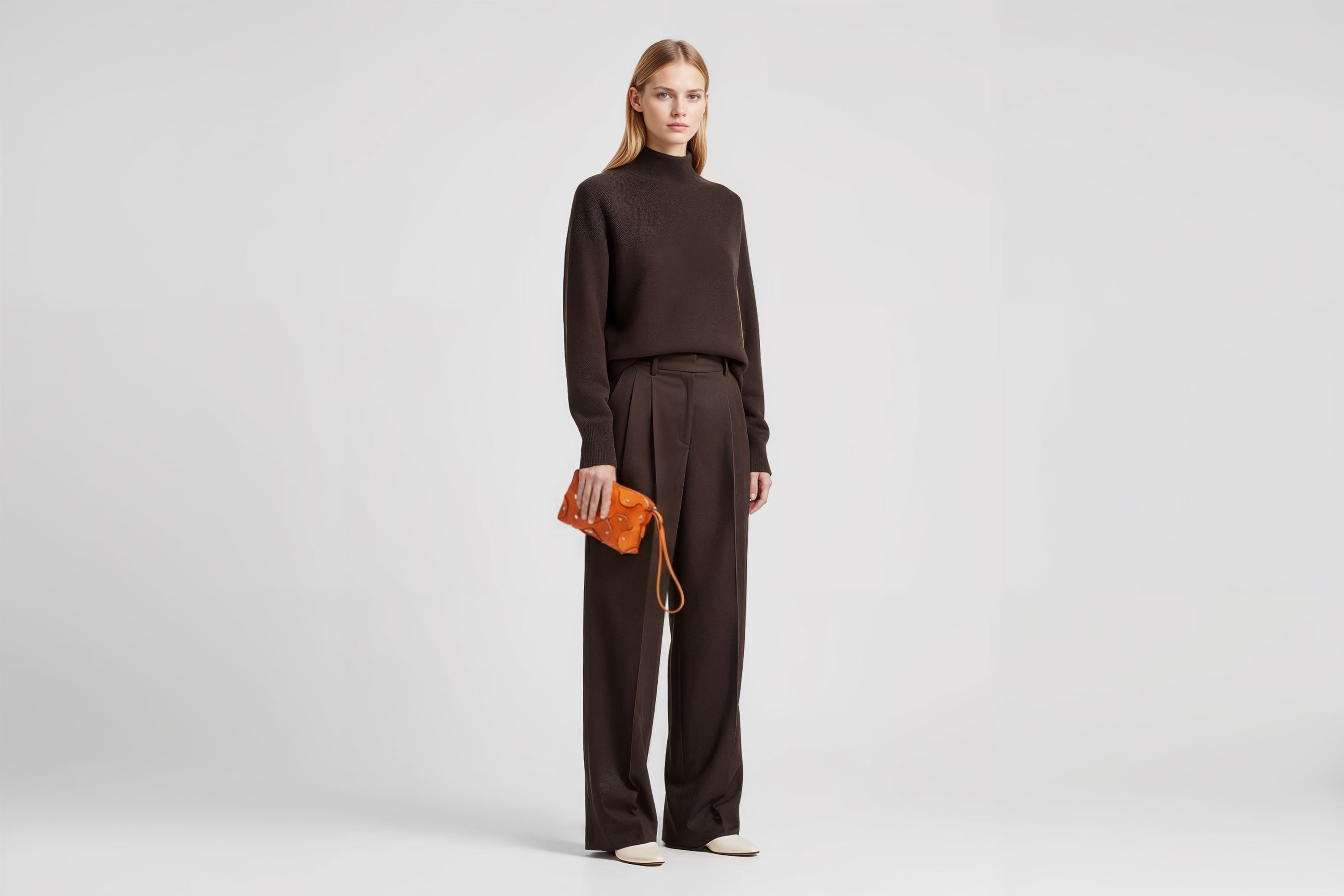 Rivet Bag Small Leather Orange Color Clutch Crossbody On Model Shoulder Detachable Full Brass Vegetable Tanned Full Grain Leather High Quality Modern Minimalistic Design Atelier Madre Manuel Dreesmann Barcelona Spain