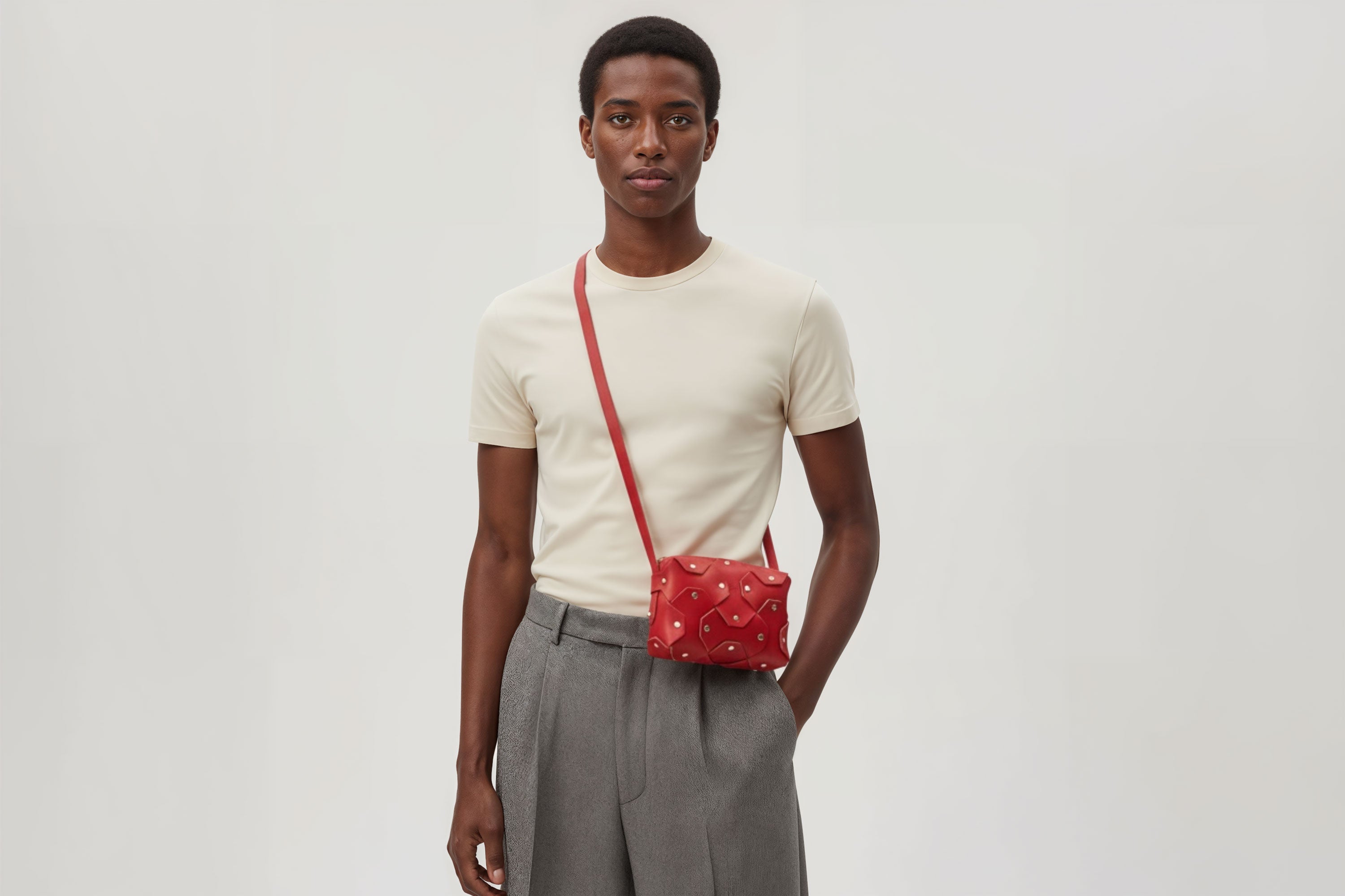 Rivet Bag Small Leather Red Color Clutch Crossbody On Model Shoulder Detachable Full Brass Vegetable Tanned Full Grain Leather High Quality Modern Minimalistic Design Atelier Madre Manuel Dreesmann Barcelona Spain