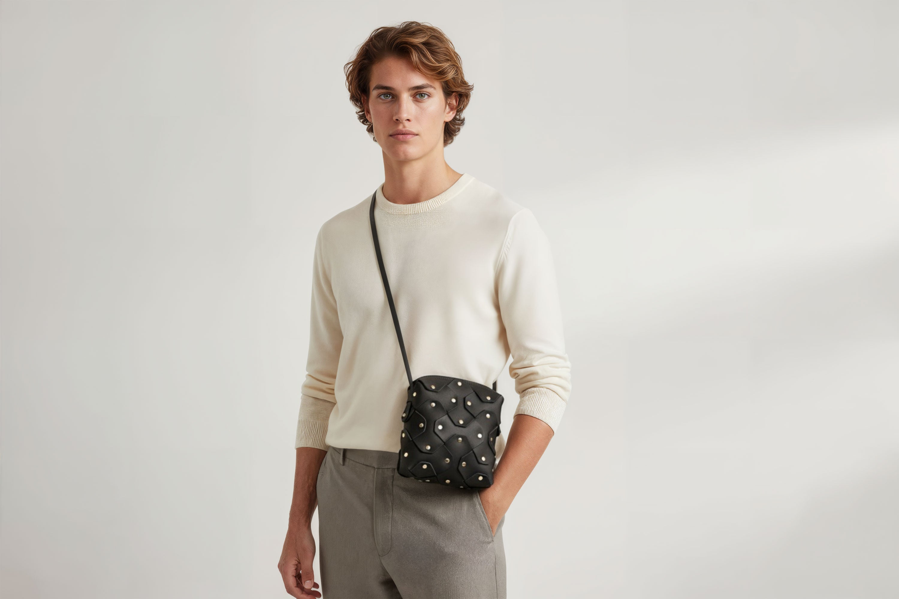 Rivet Bag Squared Black Color Leather On a Man Model Bag Minimalist Modern Design Premium Quality Atelier Madre Manuel Dreesmann Barcelona