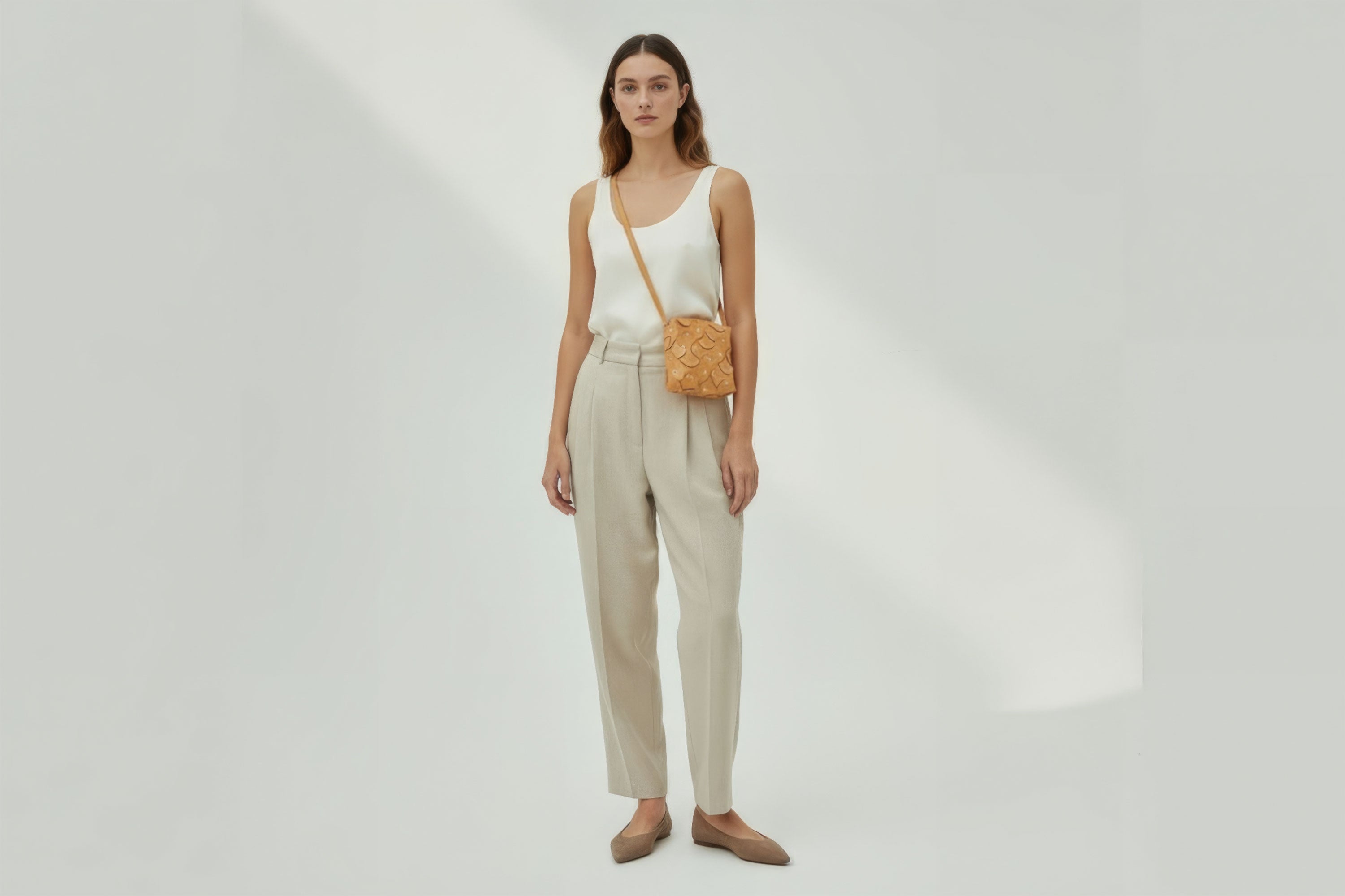 Rivet Bag Squared Brown Color Leather On a Woman Model Bag Minimalist Modern Design Premium Quality Atelier Madre Manuel Dreesmann Barcelona