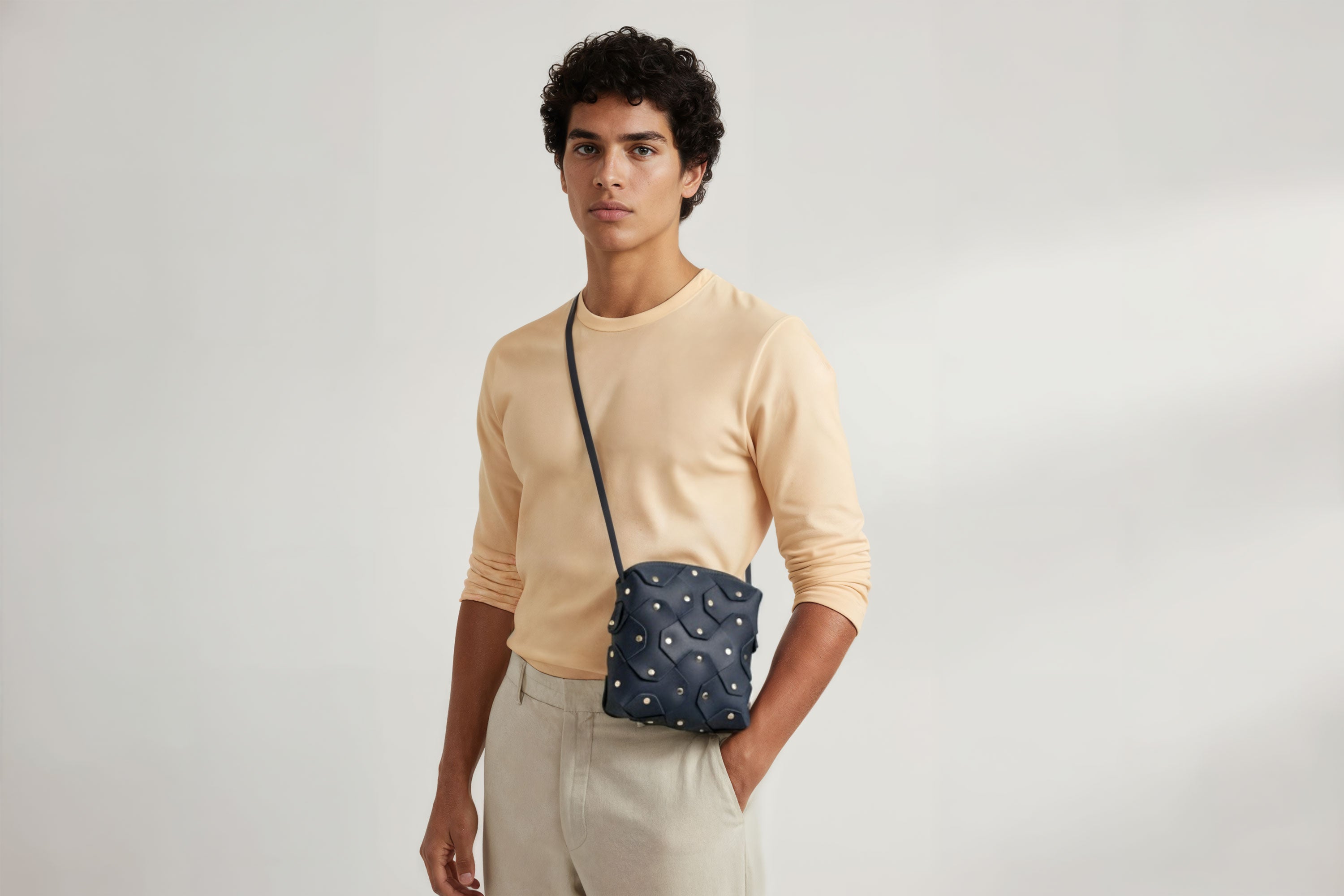 Rivet Bag Squared Marine Blue Colour Leather Bag On A Man Model Minimalist Modern Design Premium Quality Atelier Madre Manuel Dreesmann Barcelona
