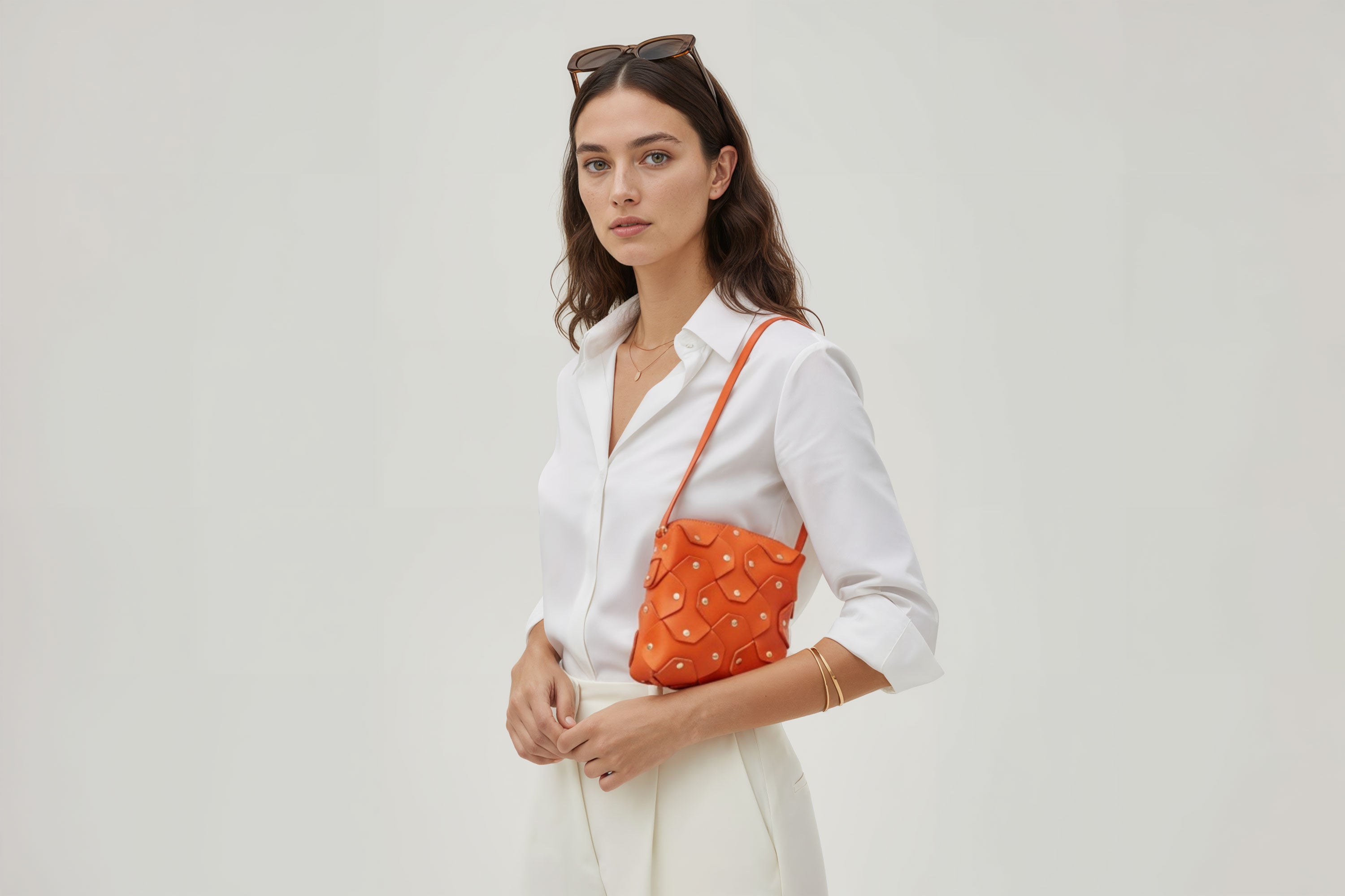 Rivet Bag Squared Orange Colour Leather Bag On A Woman Model Minimalist Modern Design Premium Quality Atelier Madre Manuel Dreesmann Barcelona