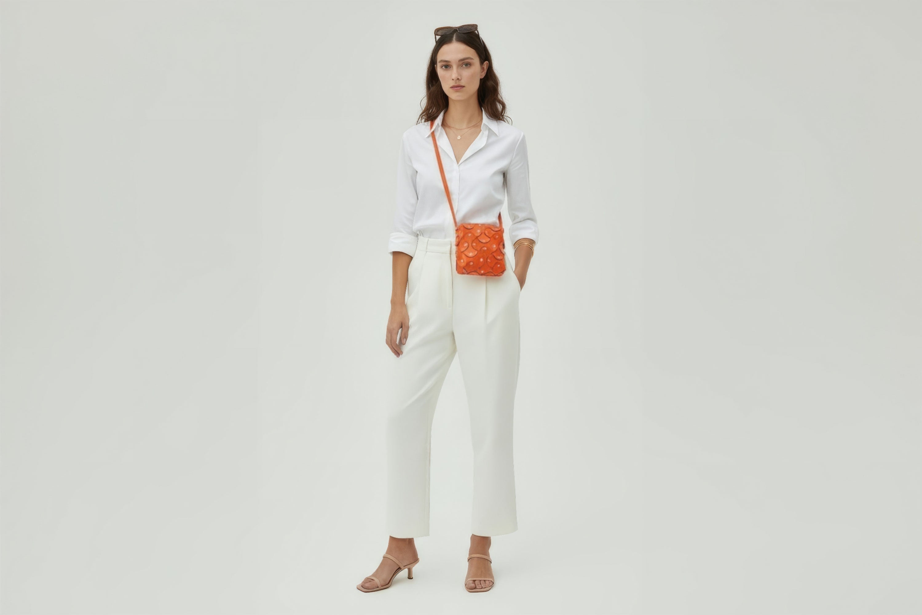 Rivet Bag Squared Orange Colour Leather Bag On A Woman Model Minimalist Modern Design Premium Quality Atelier Madre Manuel Dreesmann Barcelona